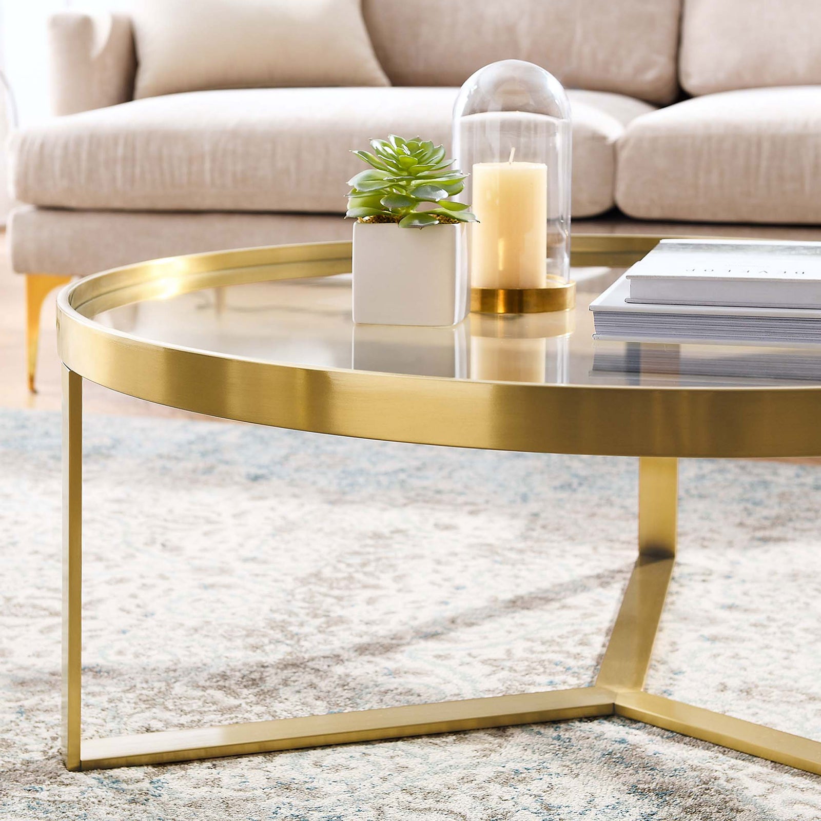 Glam coffee table adds a brushed gold accent and clear surface to modern living spaces || EEI-6153-GLD || detail_room
