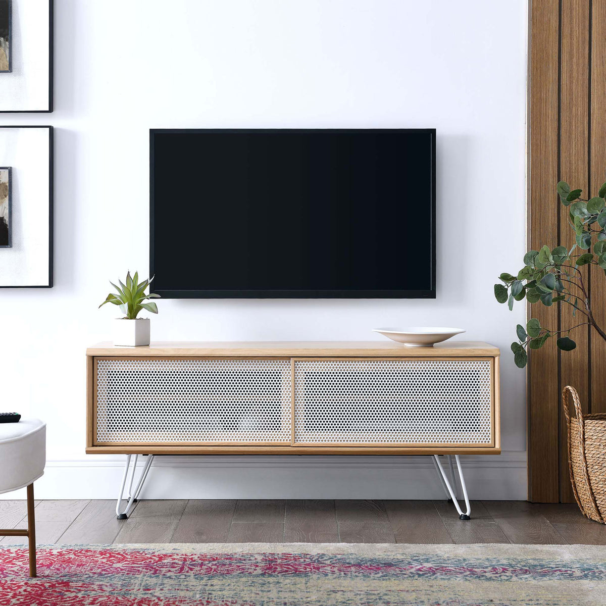 Oak 47 inch TV stand with white mesh doors and hairpin legs as the centerpiece of a bright living room || EEI-6202-OAK || front_angle_room