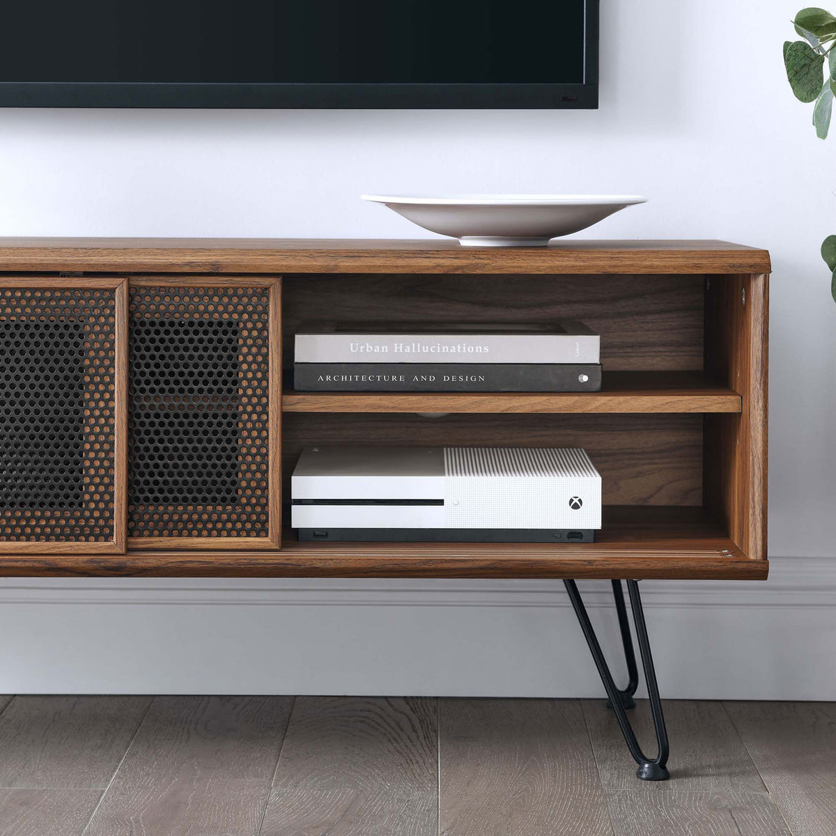 Walnut TV stand styled in a living room, showing open shelves for consoles and books beside the mesh doors || EEI-6202-WAL || storage_room