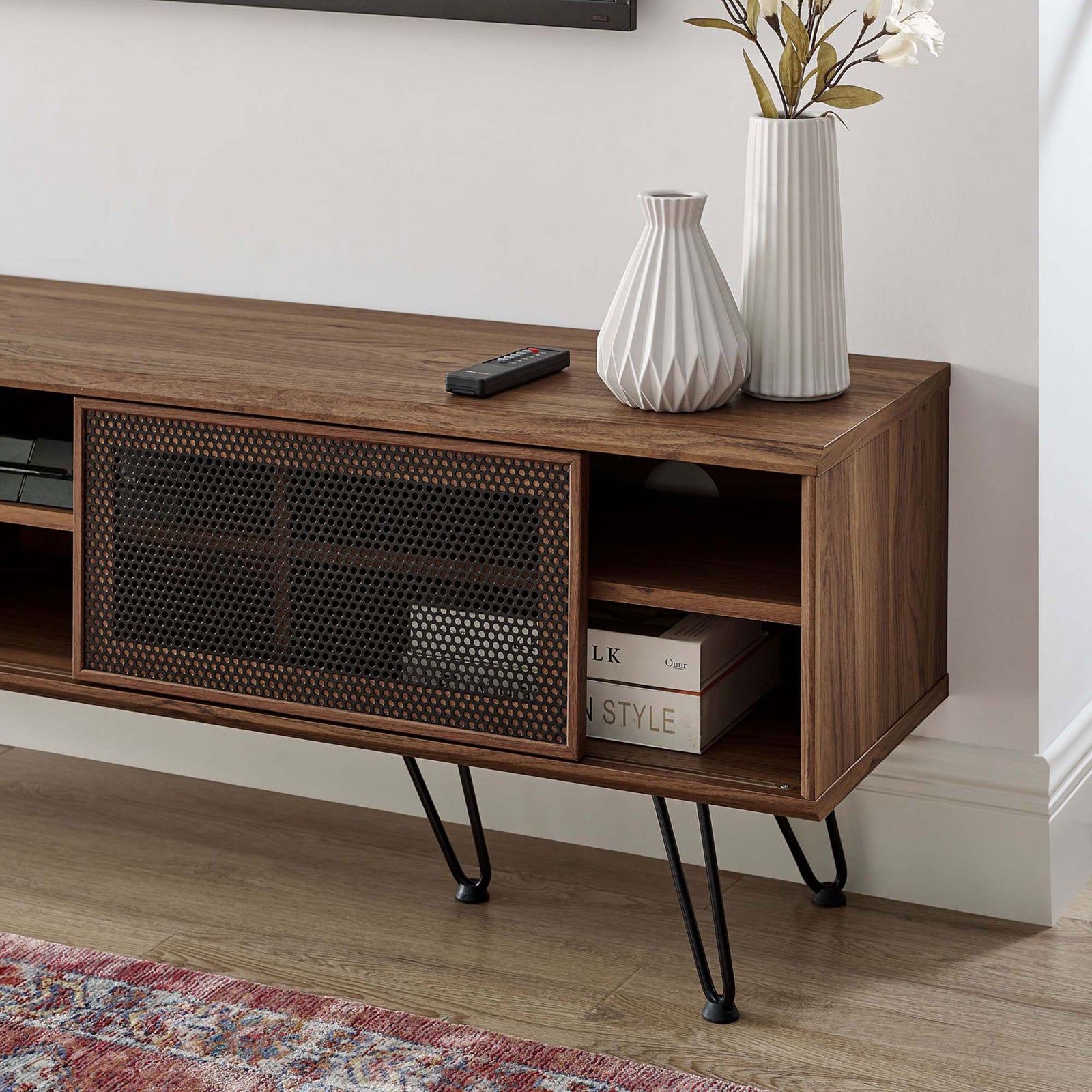 Walnut TV stand styled with decor, showing open shelves for media gear and books beside the sliding black door || EEI-6203-WAL || storage_room