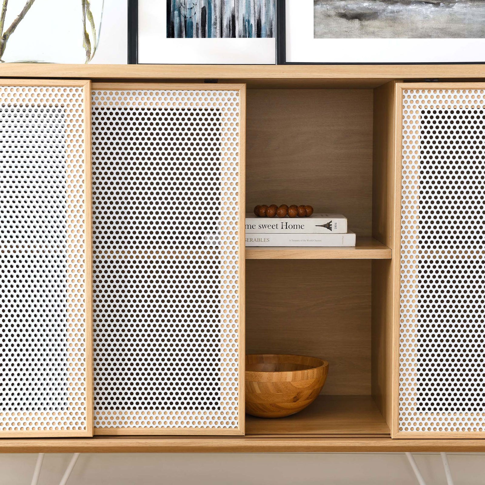 Decor pieces sit on the open shelf between perforated mesh doors || EEI-6204-OAK || storage_open_room