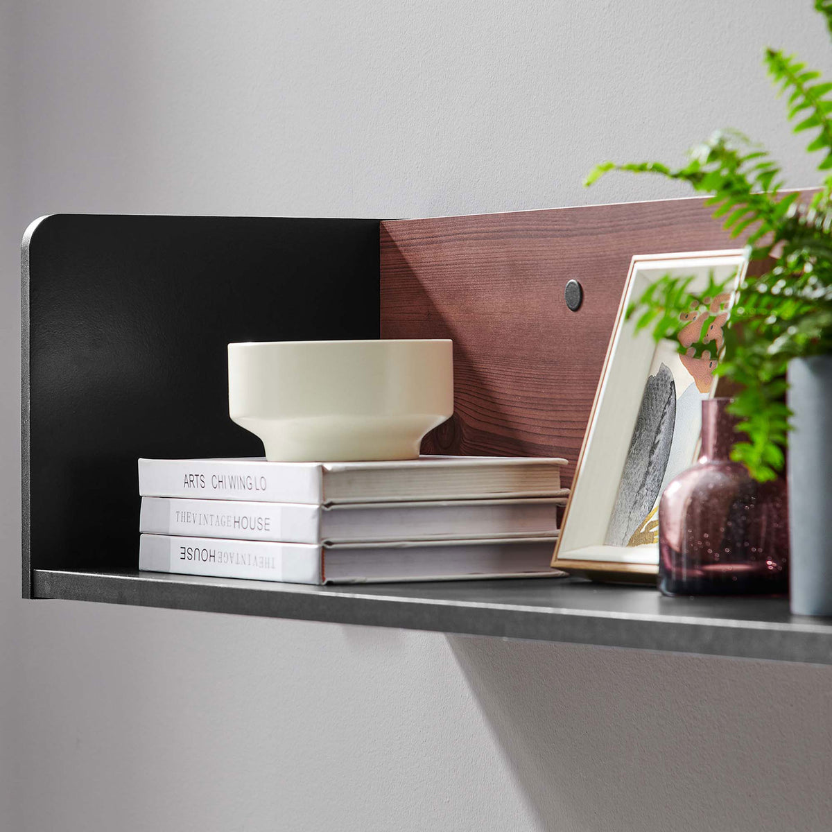 Black cherry wall shelf styled with books, ceramics, and plants to showcase its practical display space. || EEI-6208-BLK-CHE || detail_room