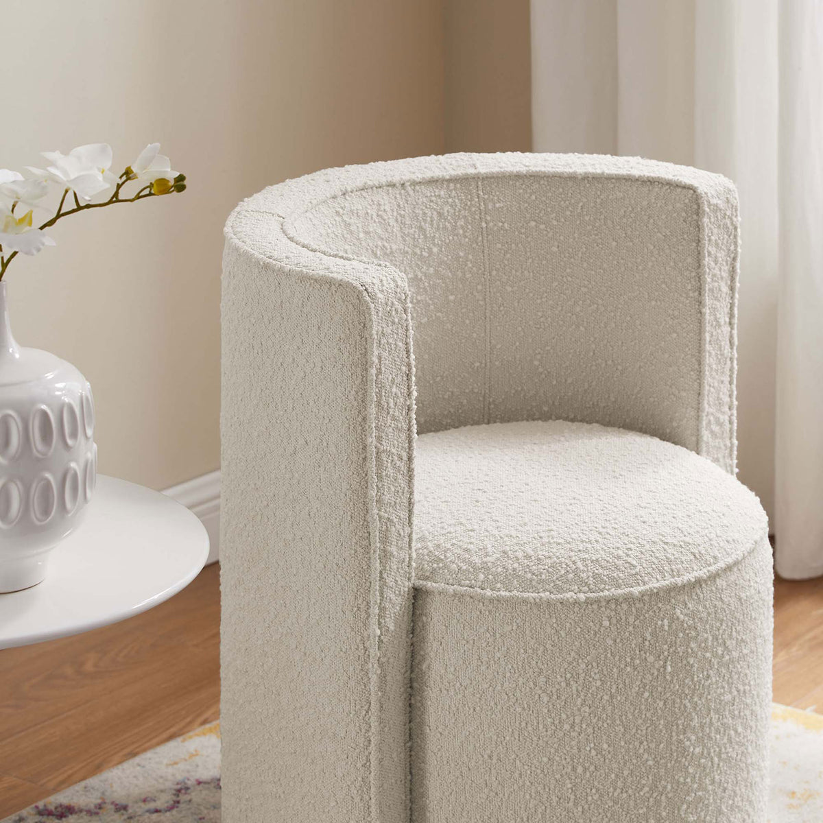 Textured ivory boucle and curved backrest bring cozy dimension beside contemporary decor. || EEI-6223-IVO || detail_room