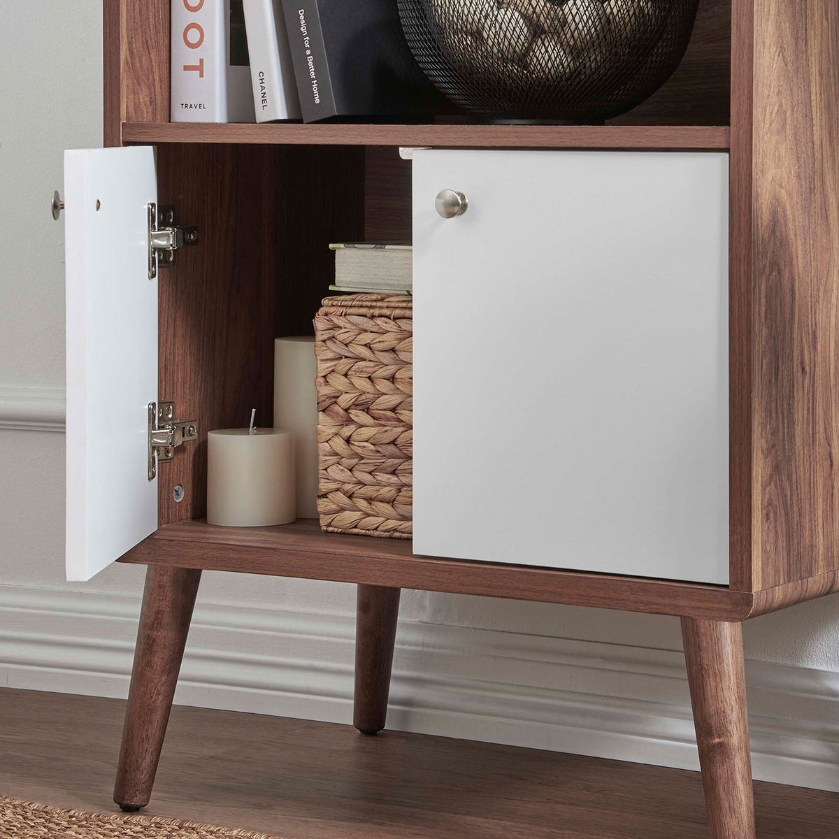 Interior storage neatly holds baskets and candles behind clean white doors. || EEI-6230-WAL-WHI || detail_room