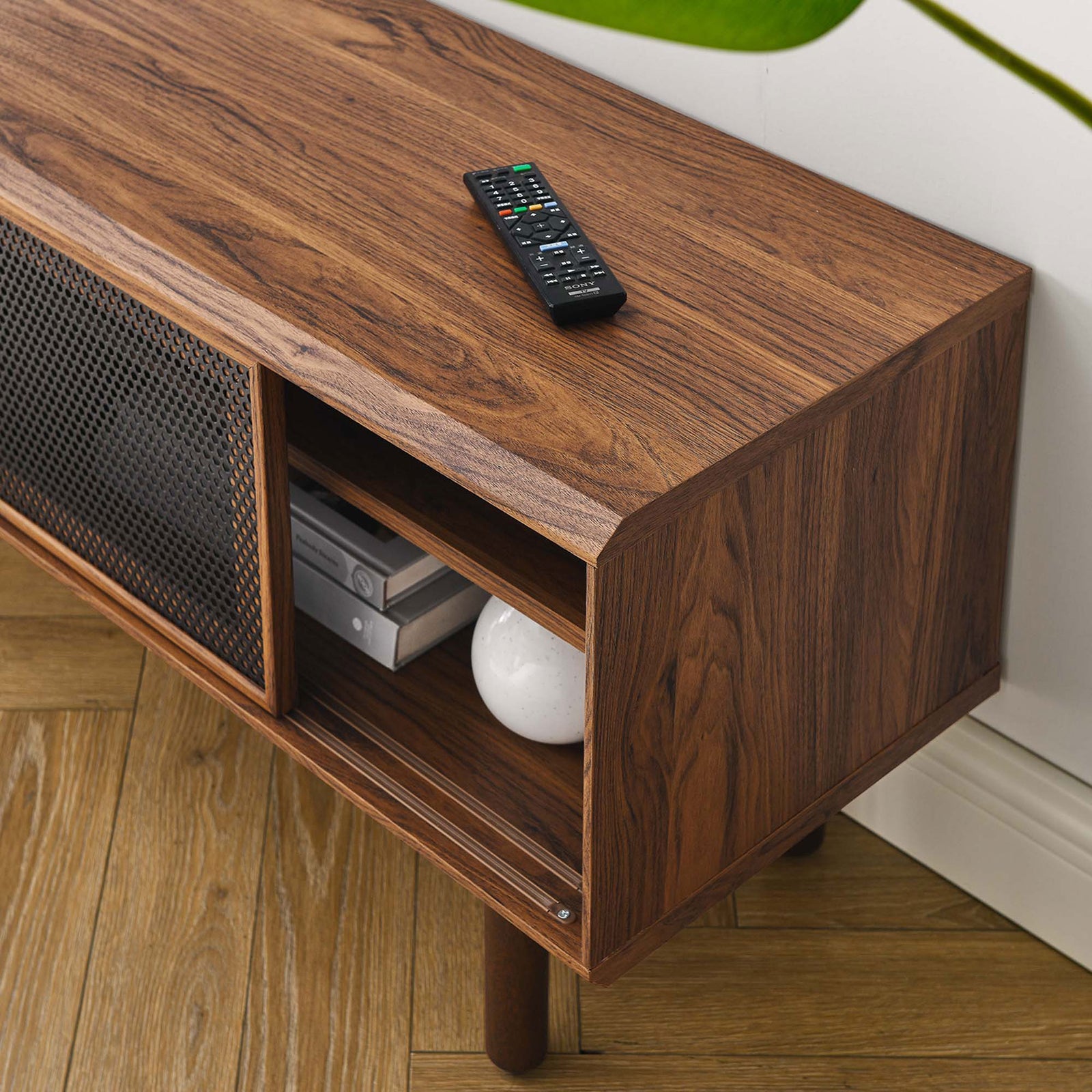 Walnut TV stand styled with books and decor, emphasizing rich wood grain and open shelf storage || EEI-6233-WAL || detail_room