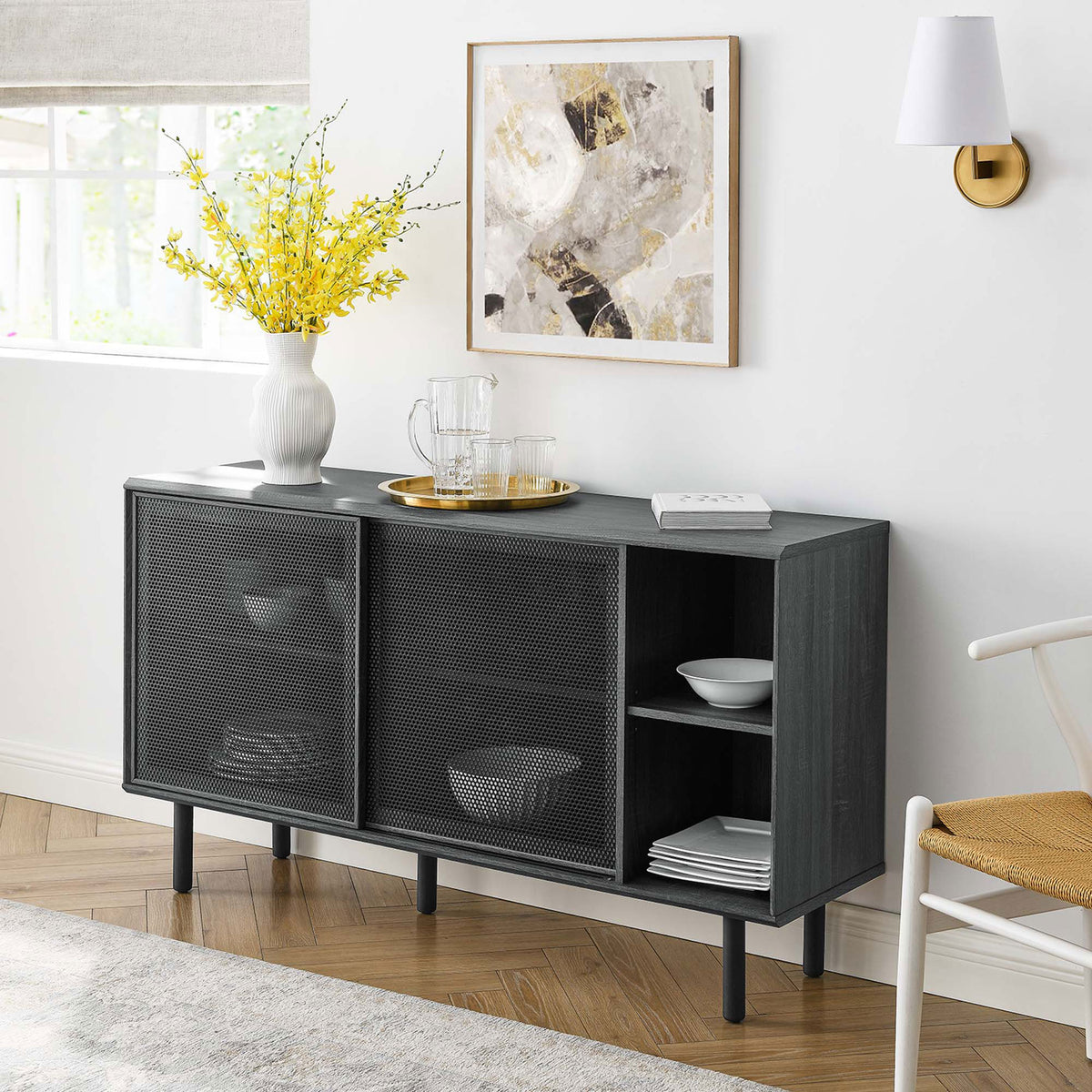 Charcoal sideboard styled with vase, tray, and artwork for a bright modern living room || EEI-6235-CHA || front_angle_room