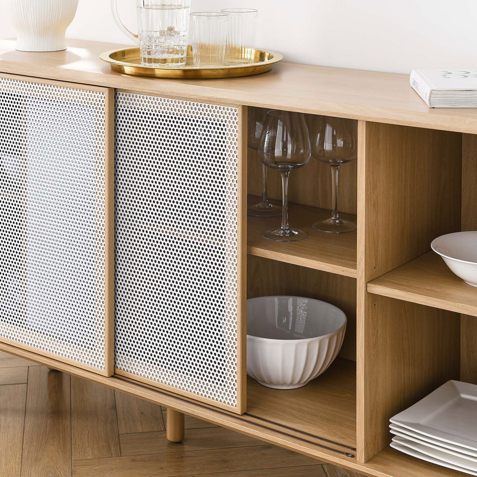 Styled oak sideboard shelves holding glassware and dishes behind the sliding mesh doors. || EEI-6235-OAK || storage_room