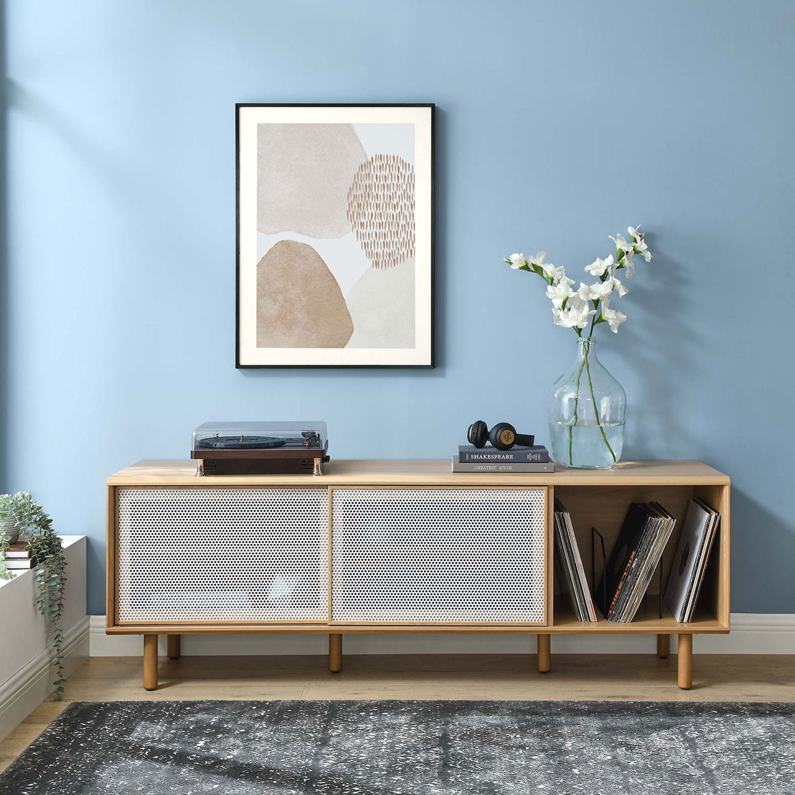 Kurtis 67 in oak TV and record stand in a modern room with turntable and wall art || EEI-6236-OAK || front_angle_room