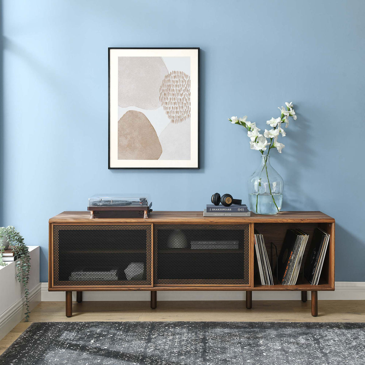 Kurtis 67 in walnut TV and record stand in a contemporary room with turntable and wall art || EEI-6236-WAL || front_angle_room