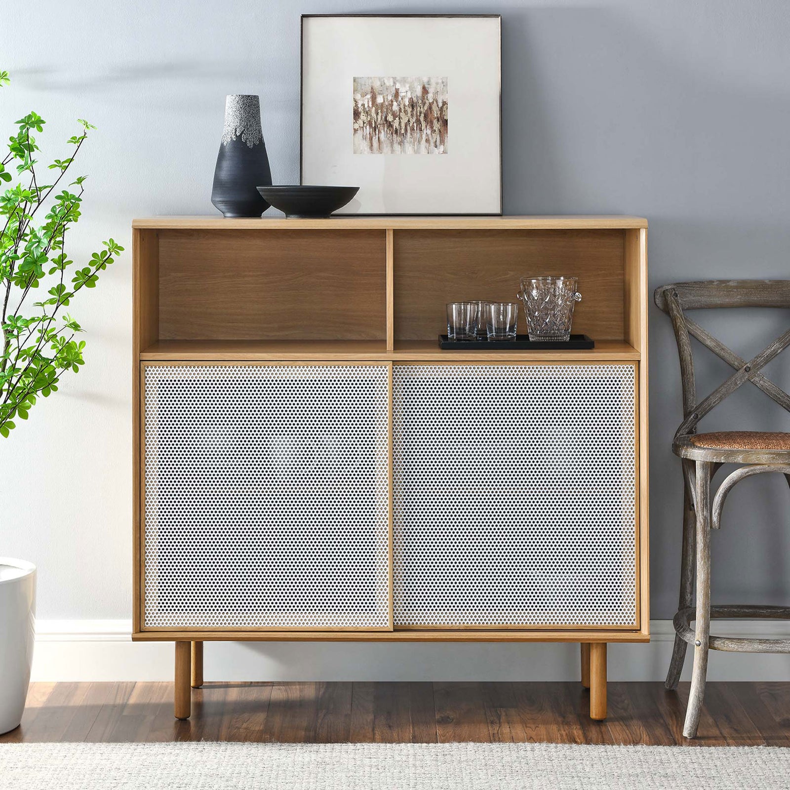 Oak display cabinet styled with ceramics and art, bringing airy, modern warmth to a dining or living room. || EEI-6237-OAK || front_room