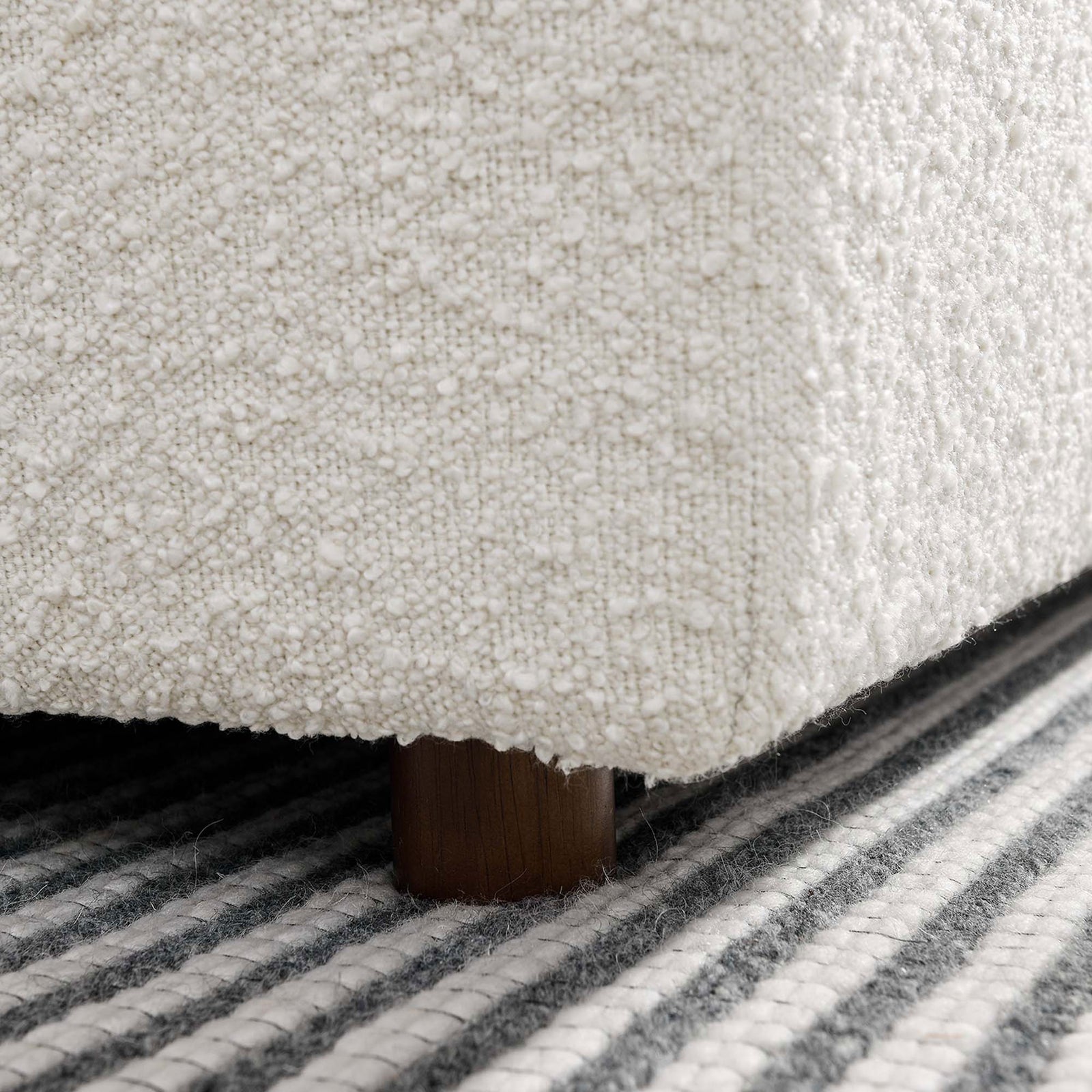 Wood feet and subtle glides sit neatly on a striped rug for a grounded feel || EEI-6257-IVO || leg_room