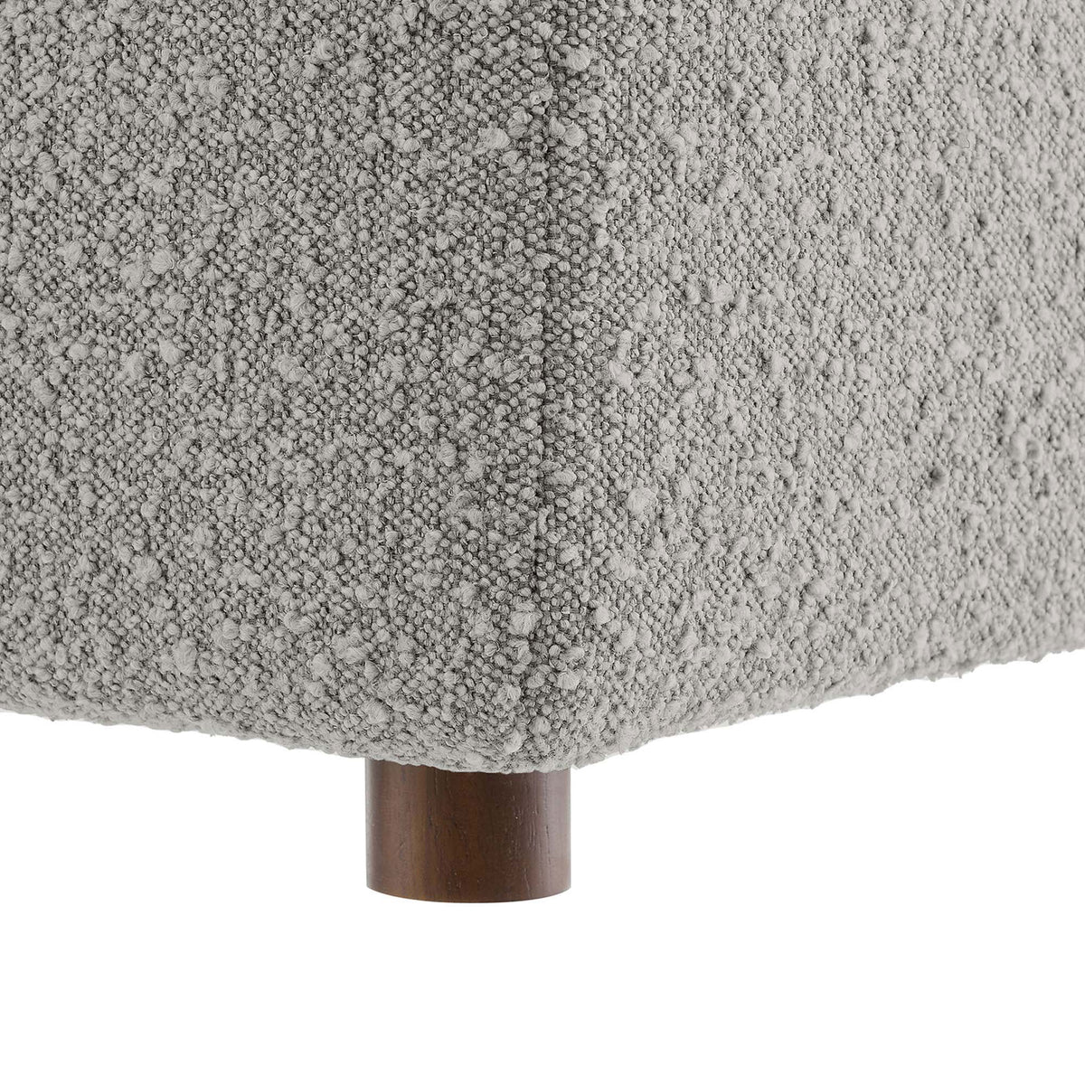 Soft boucle fabric and smooth wood feet highlight the ottoman's cozy texture and subtle mid-century charm || EEI-6258-LGR || leg_studio