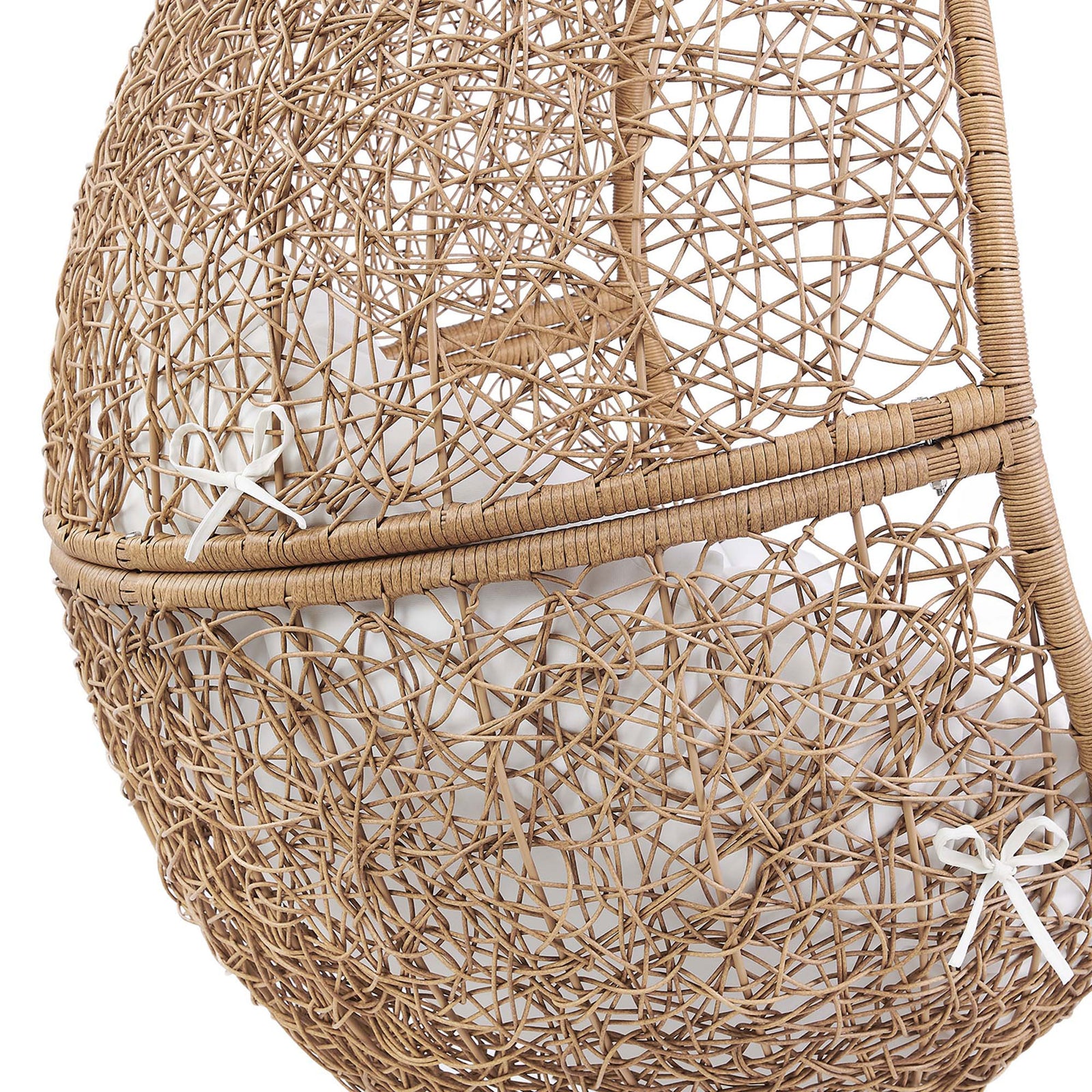 Tight rattan lattice with white ties secures the plush cushion, adding handcrafted charm to the swing basket. || EEI-6262-CAP-WHI || detail_studio
