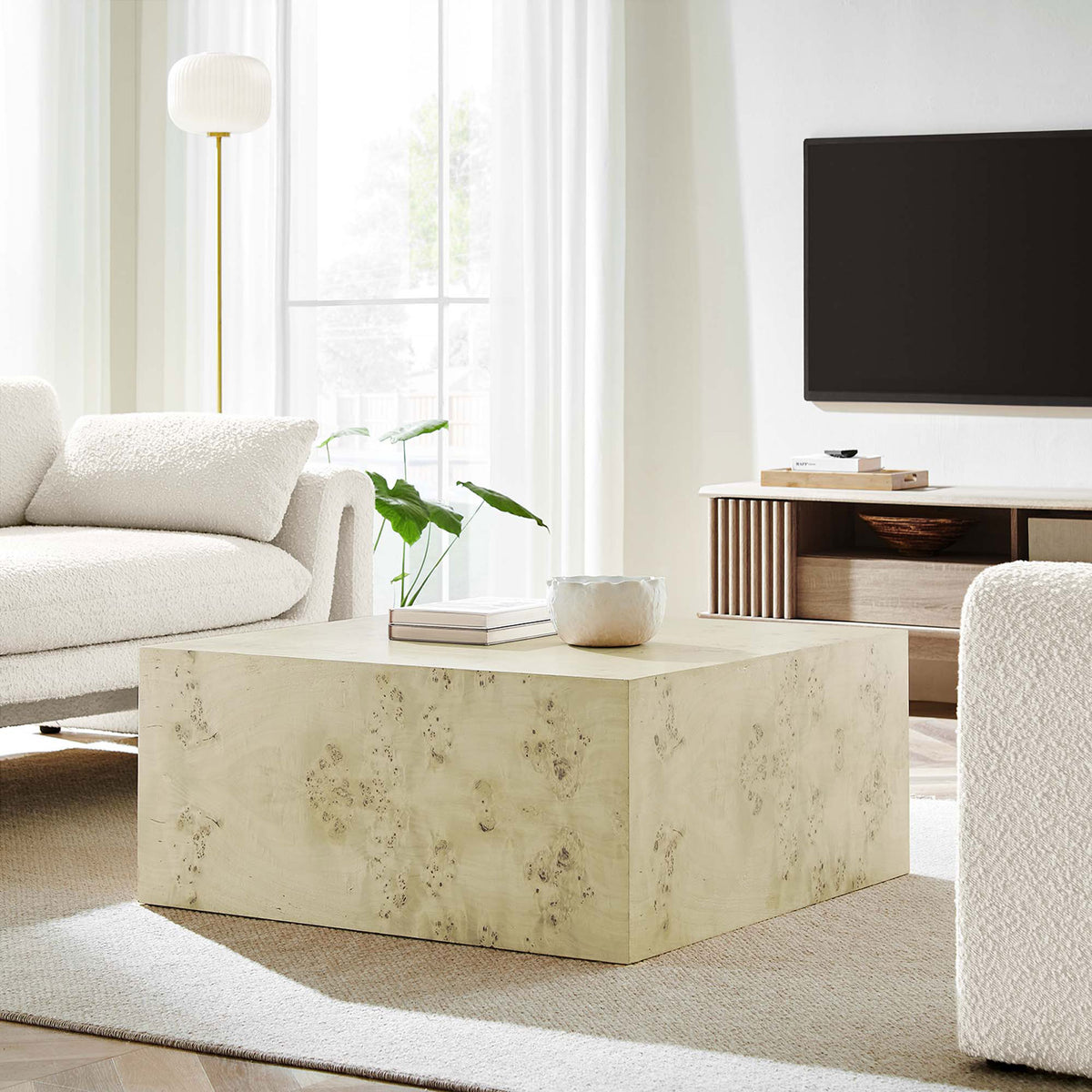Elevates a living room with its minimalist cube form and softly toned bleached burl finish || EEI-6272-BLB || front_angle_room