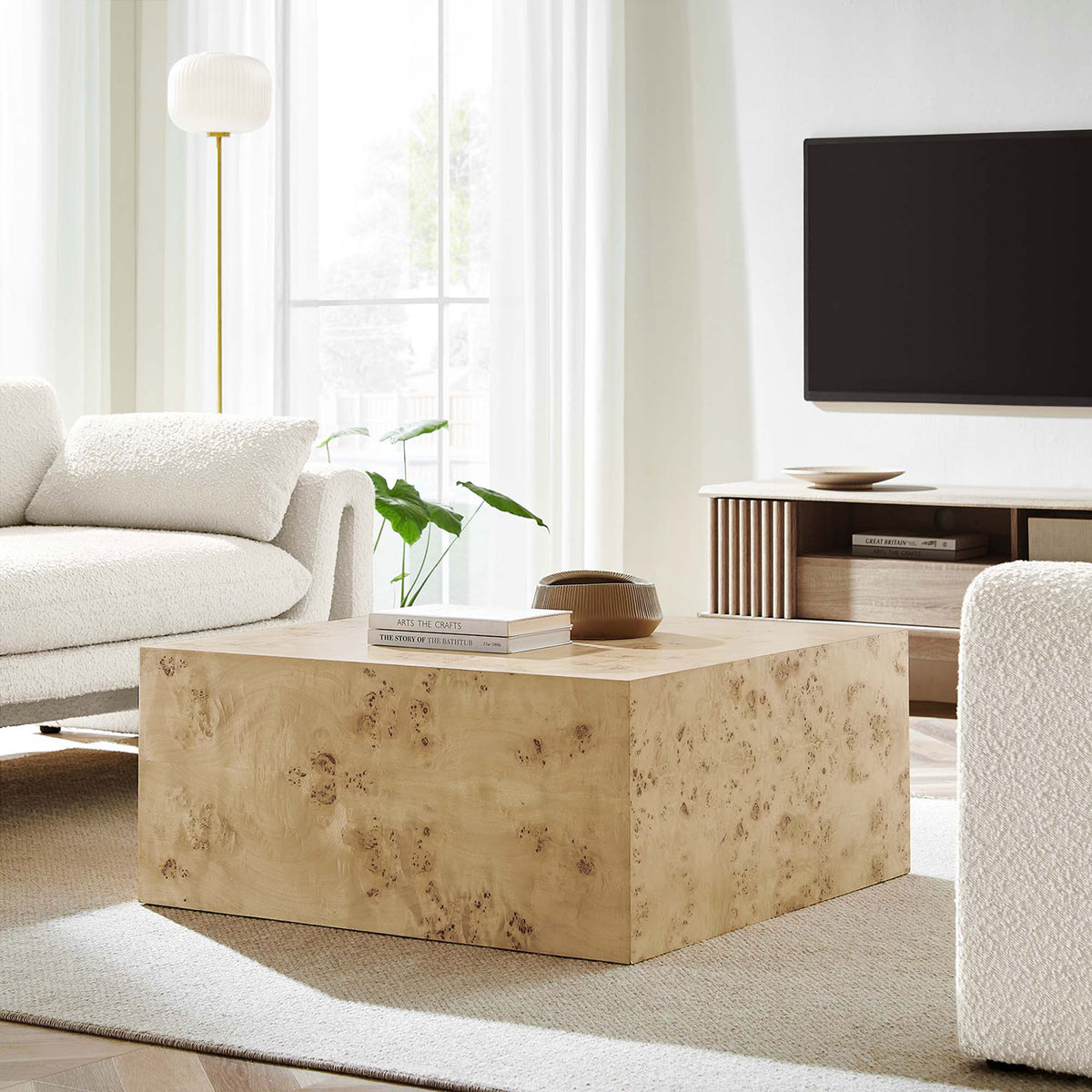 Statement burl wood coffee table anchors the room with its minimalist block form and natural tone || EEI-6272-NAB || front_angle_room