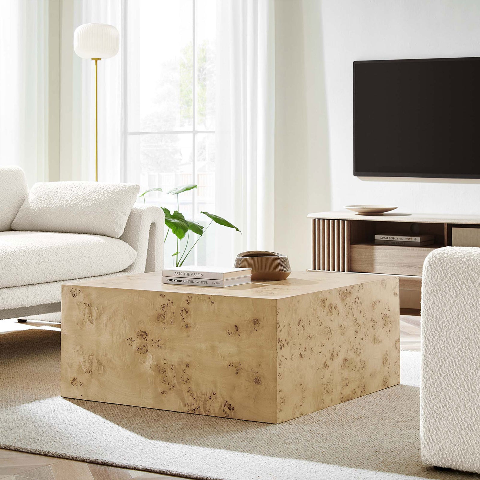 Statement burl wood coffee table anchors the room with its minimalist block form and natural tone || EEI-6272-NAB || front_angle_room