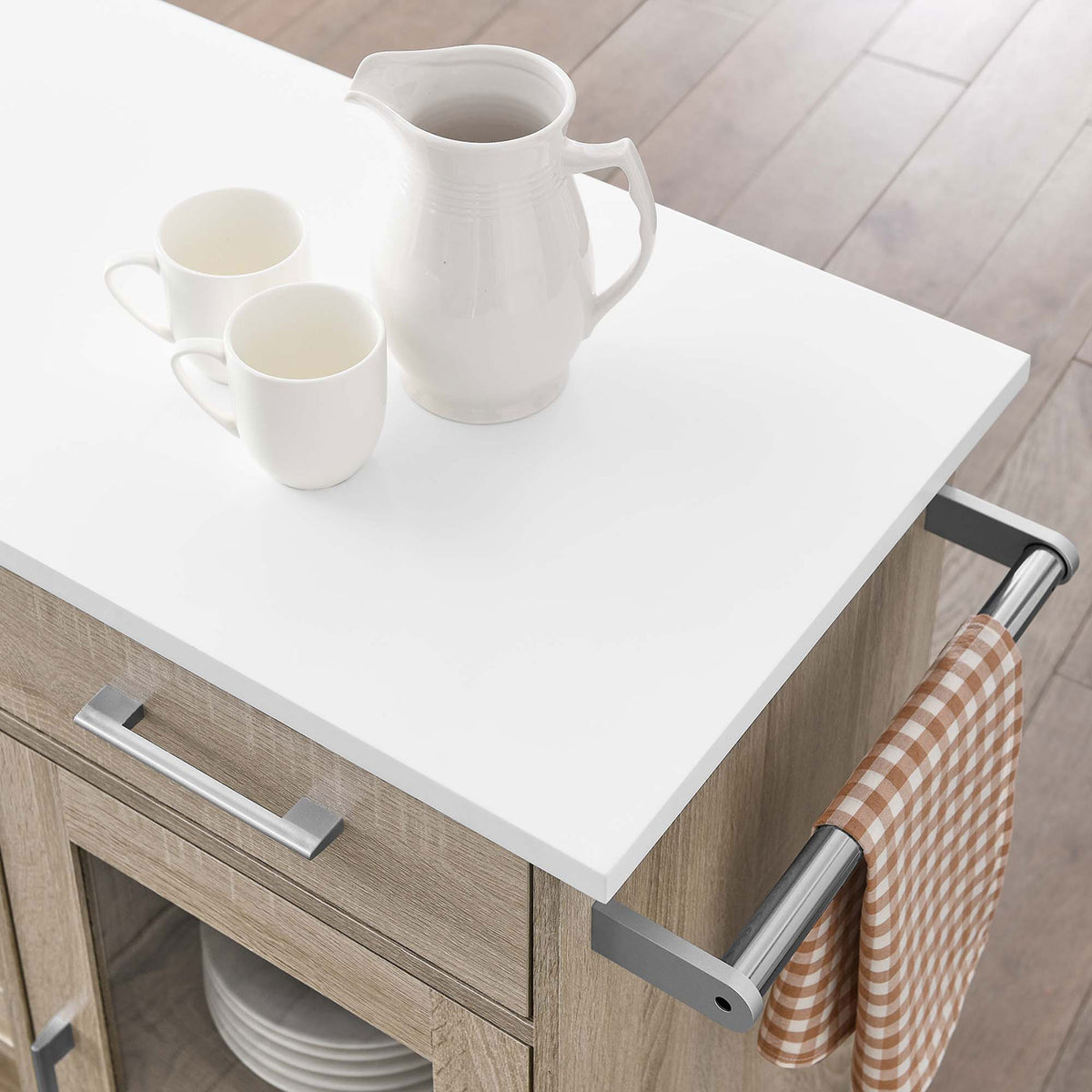 Styled kitchen cart top with white surface, serving pieces, and checked towel hanging from side bar || EEI-6275-OAK-WHI || detail_room