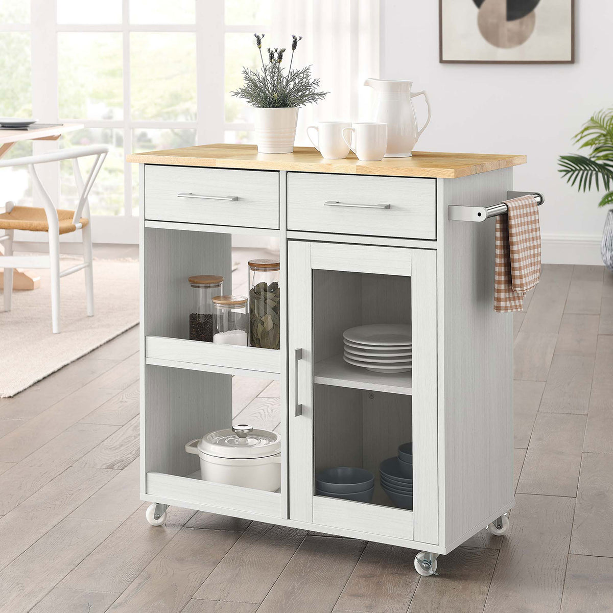 White kitchen cart styled in a bright dining space with cookware and dishes organized on the shelves and inside || EEI-6275-WHI-NAT || front_angle_room