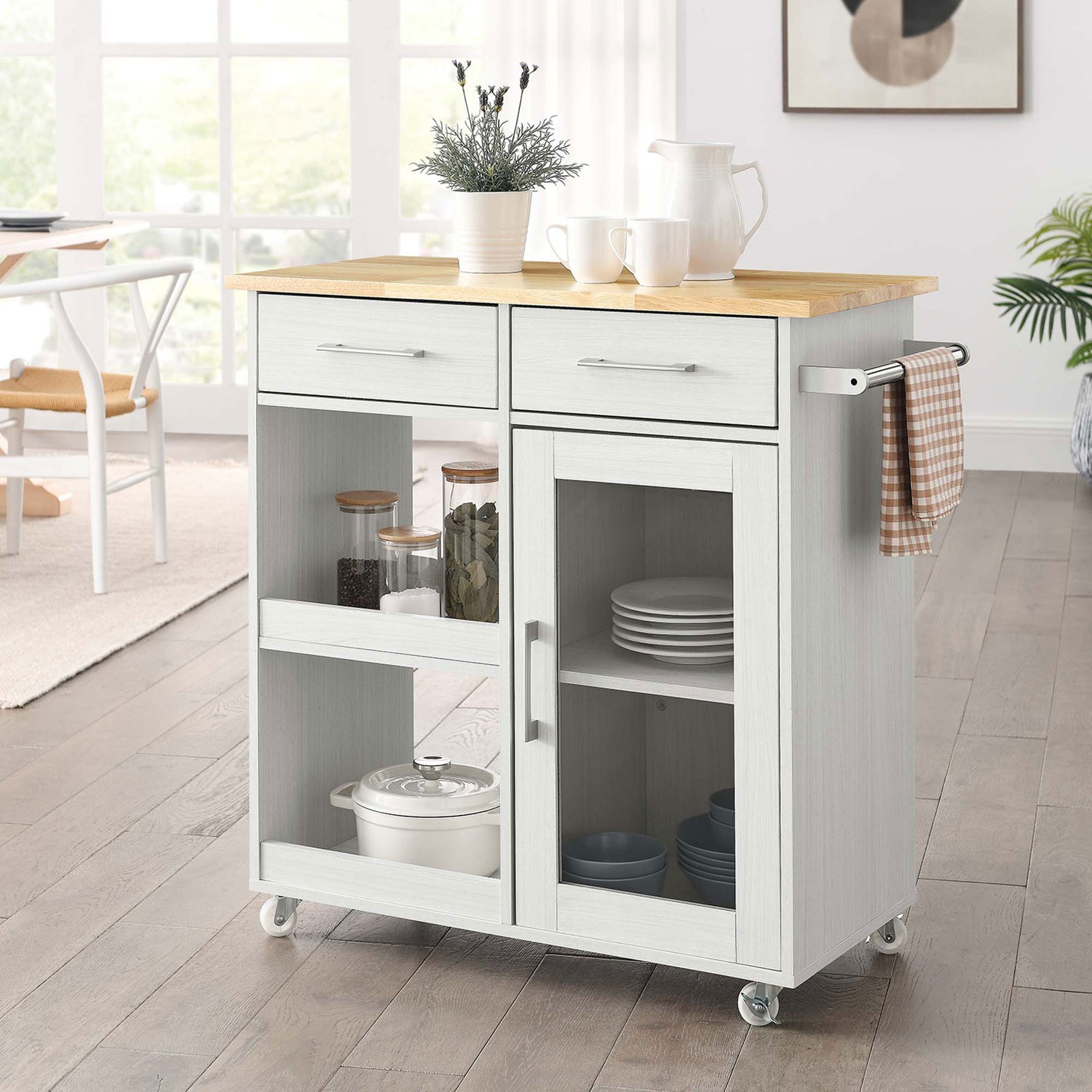 White kitchen cart styled in a bright dining space with cookware and dishes organized on the shelves and inside || EEI-6275-WHI-NAT || front_angle_room