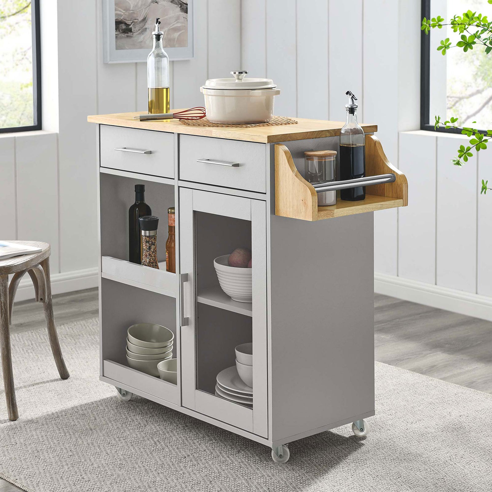 Culinary kitchen cart styled as a coffee bar with bottles, cookware, and glass-front storage. || EEI-6277-LGR-NAT || front_angle_room