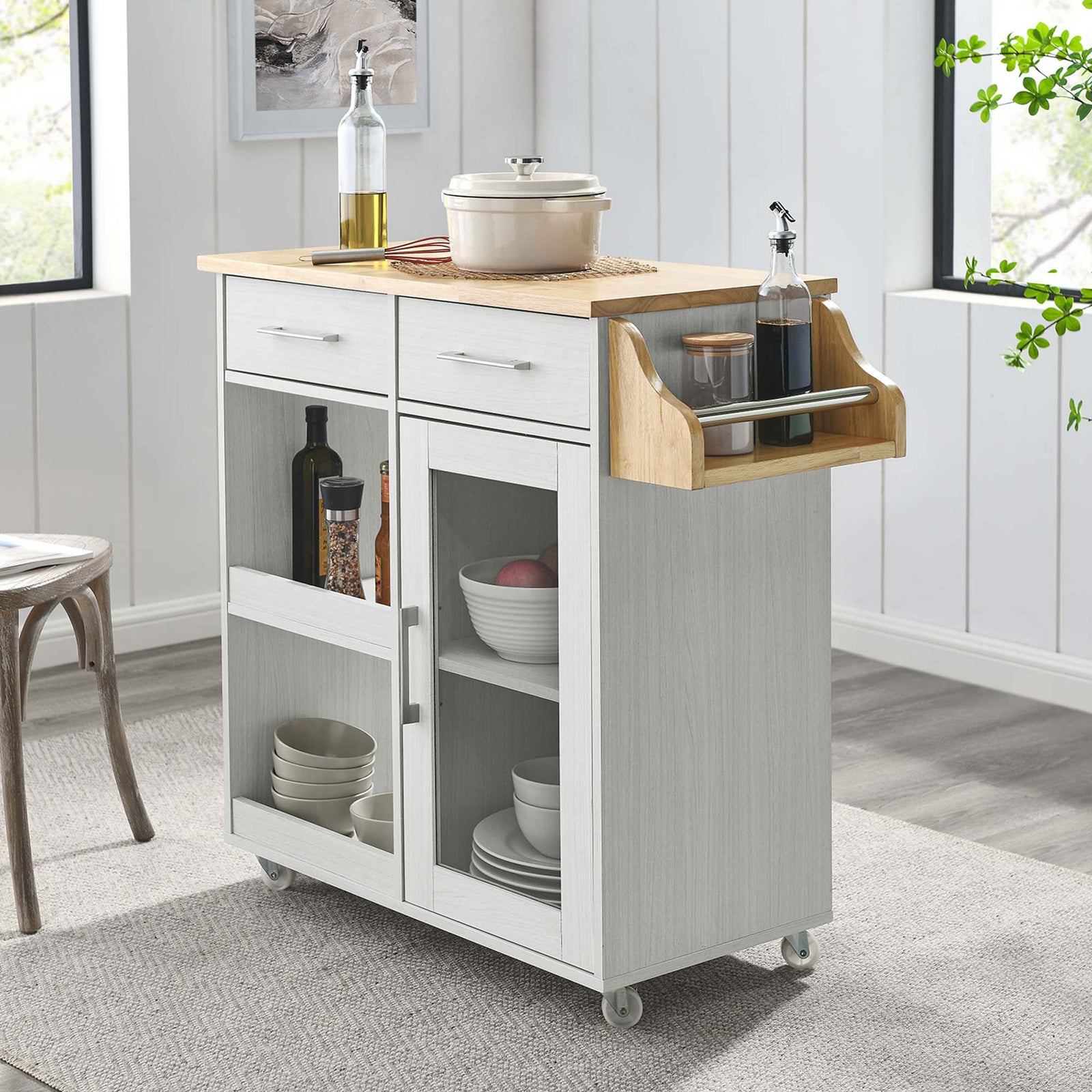Kitchen cart styled in a bright dining space with dishes and bottles organized || EEI-6277-WHI-NAT || front_angle_room