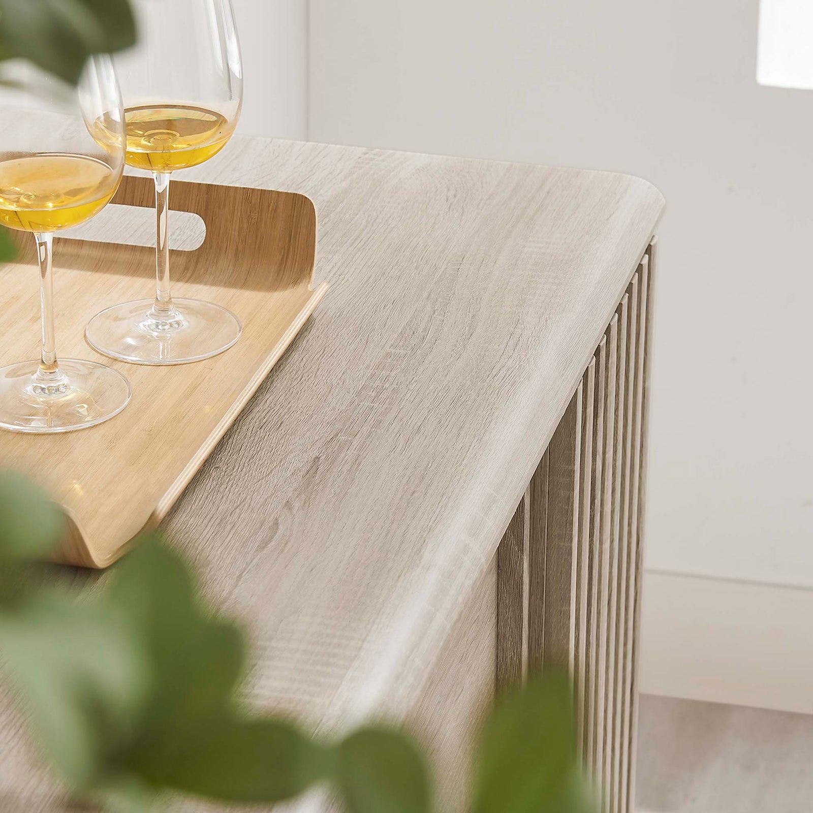 Oak sideboard top styled with tray, drinks, and greenery in a bright room || EEI-6278-OAK || detail_room
