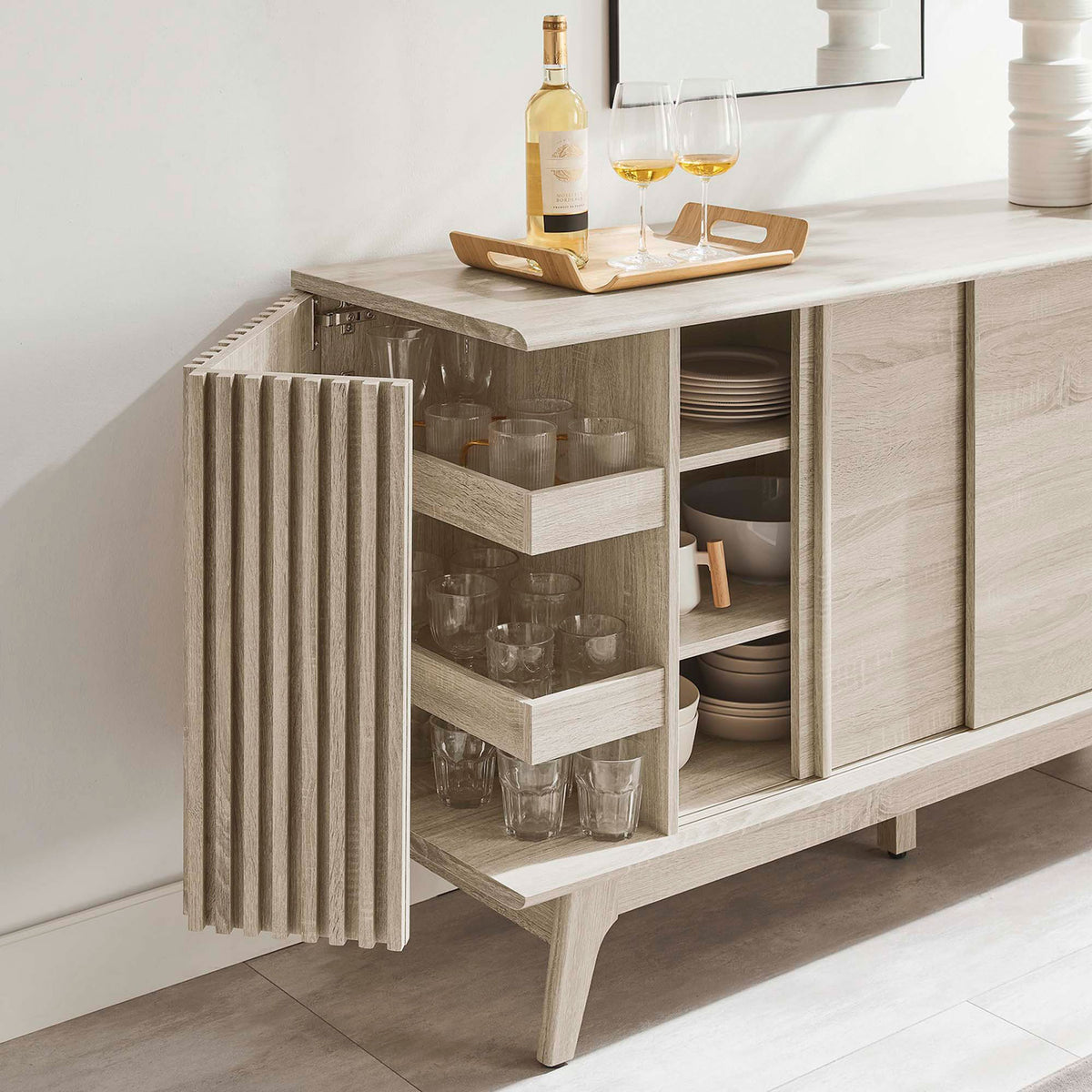 Oak sideboard with open doors displaying organized dishes and glassware in use || EEI-6278-OAK || front_angle_open_room