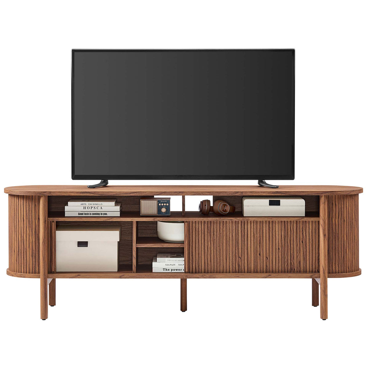 Walnut Cadence TV stand holding a television and decor to inspire modern living room styling. || EEI-6310-WAL || front_room