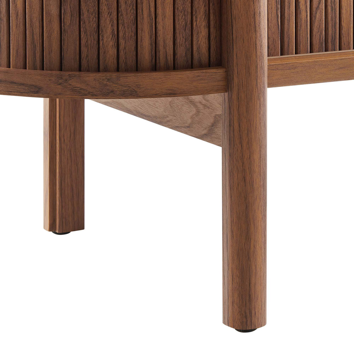 Rounded walnut leg and stretcher base supporting the Cadence TV stand with modern warmth. || EEI-6310-WAL || leg_studio