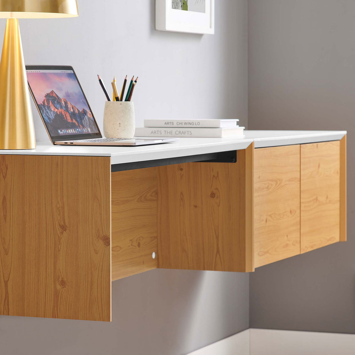 Wall-mounted desk creates an airy workspace with hidden cable management and clean, two-tone finish || EEI-6311-WHI-NAT || front_angle_partial_room