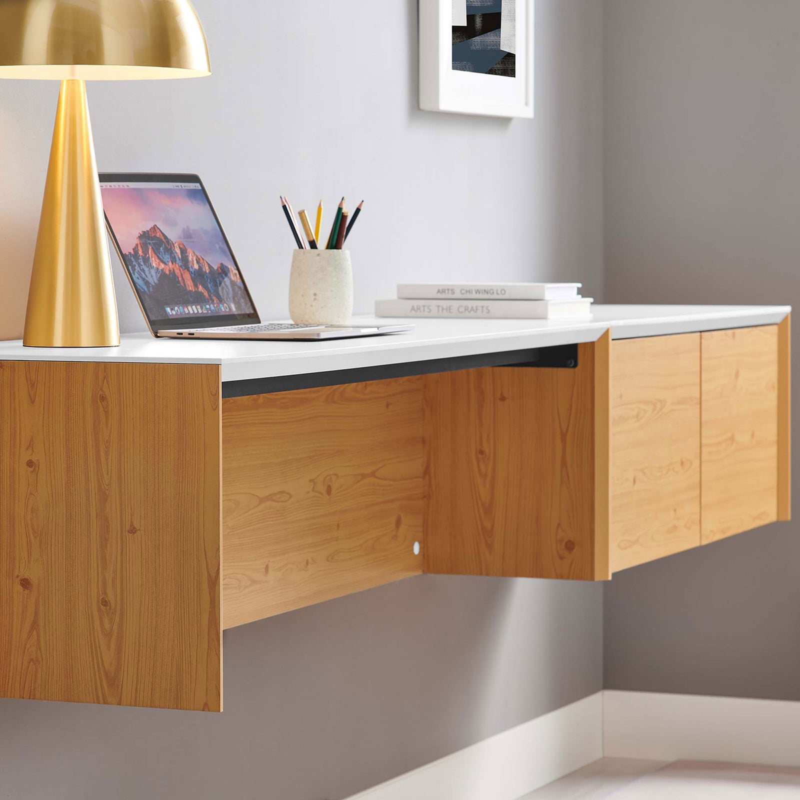 Sleek wall-mounted desk offers generous workspace while freeing floor space in a modern room || EEI-6312-WHI-NAT || front_angle_partial_room
