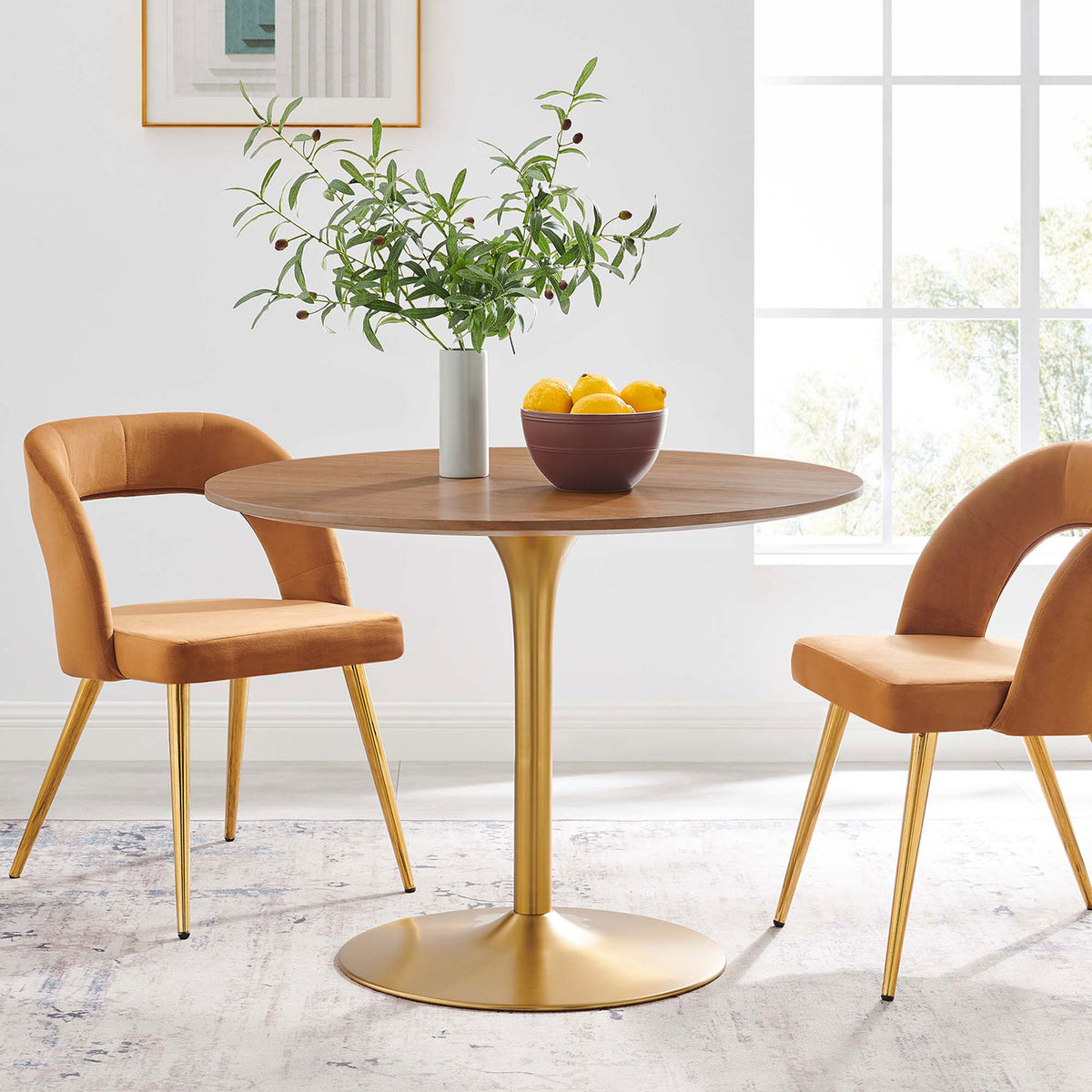 Round walnut and gold dining table paired with modern chairs, creating a bright, inviting dining nook || EEI-6313-WAL-GLD || front_angle_room