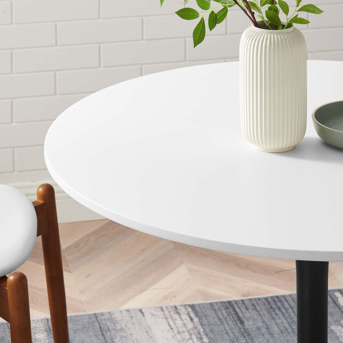 Styled white tabletop with vase and bowl accents highlighting smooth easy clean dining surface || EEI-6313-WHI-BLK || detail_room