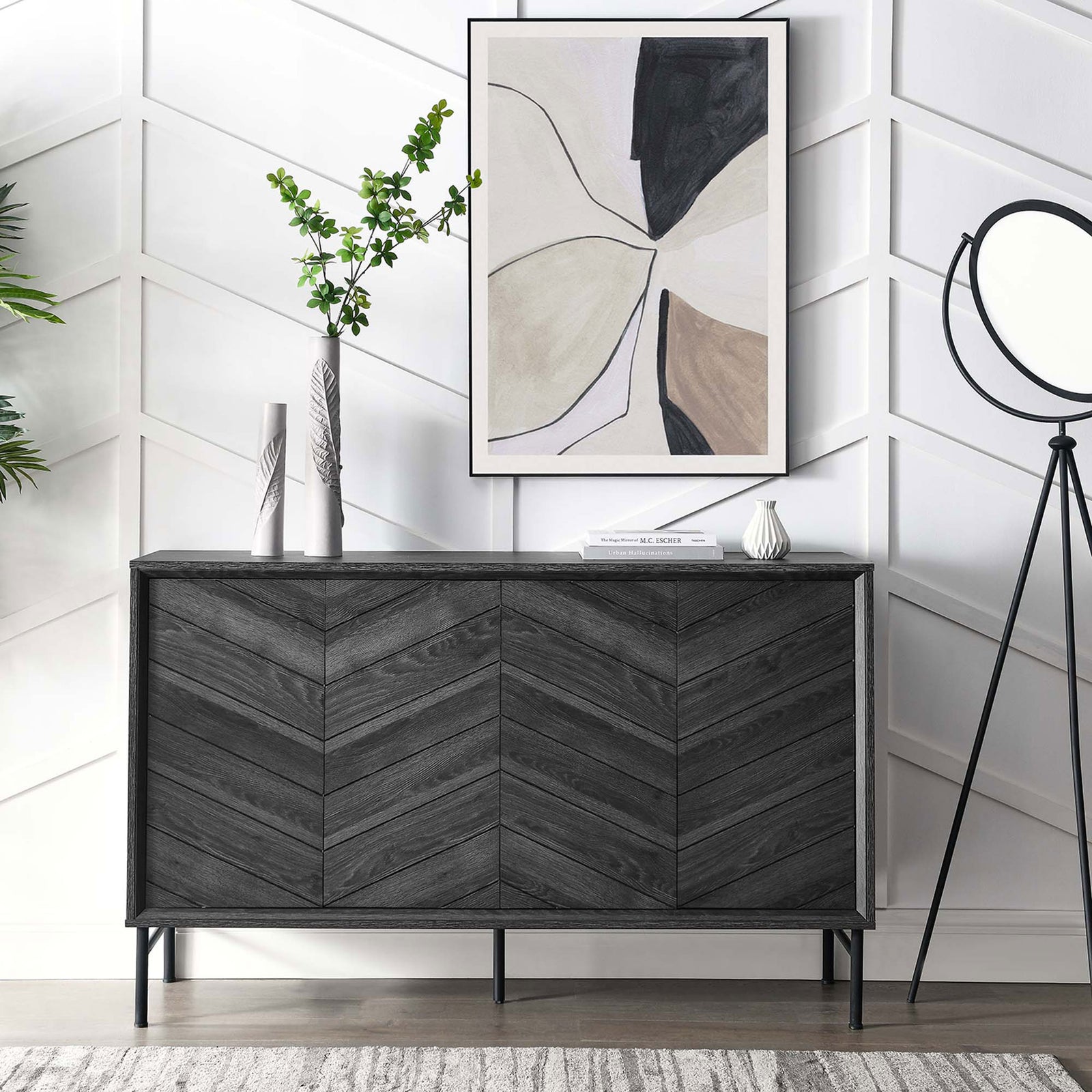 Harper black chevron sideboard styled in a modern living room with artwork and decor accents || EEI-6336-BLK || front_room