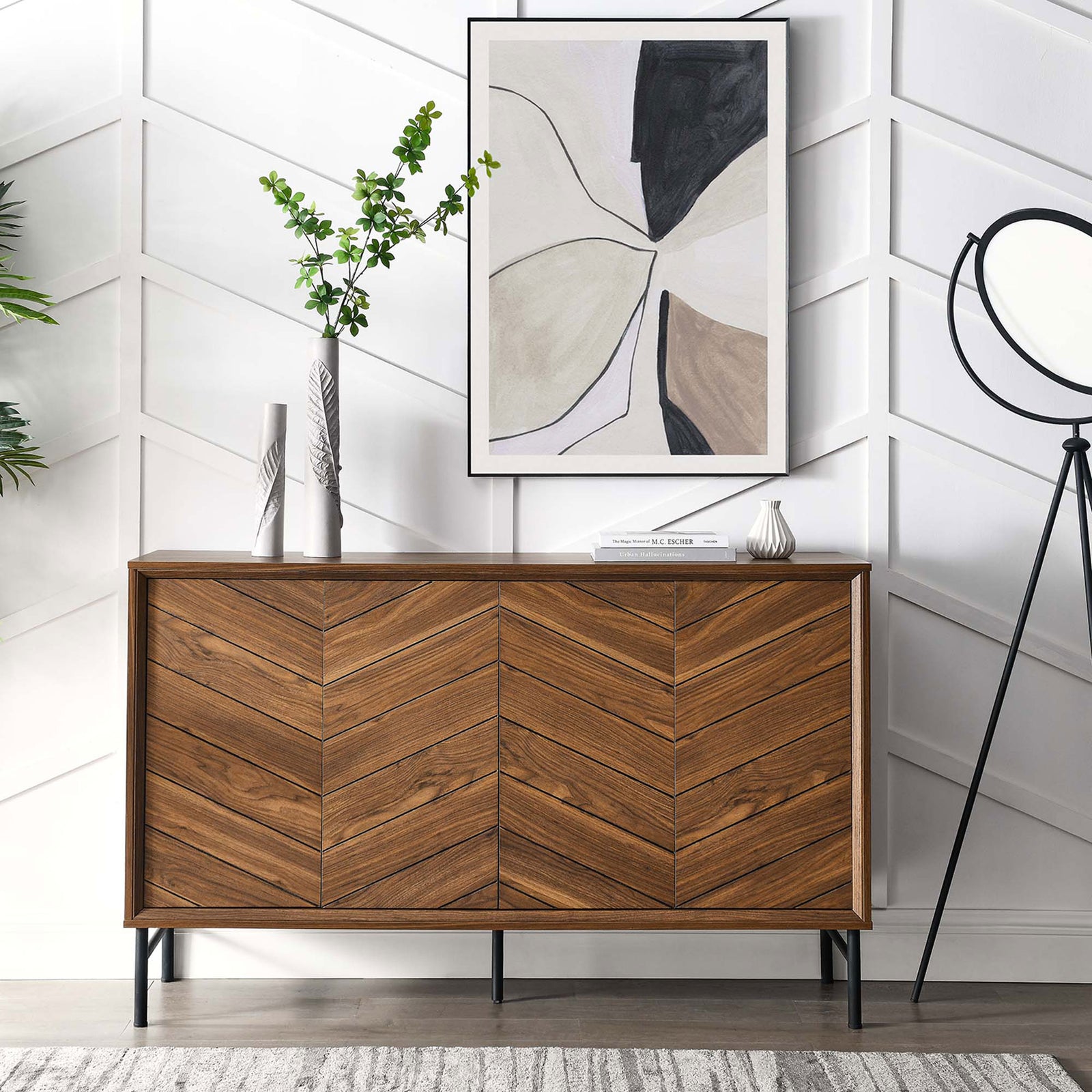 Chevron sideboard in a modern entryway, topped with art and greenery for a warm, inviting look. || EEI-6336-WAL || front_room
