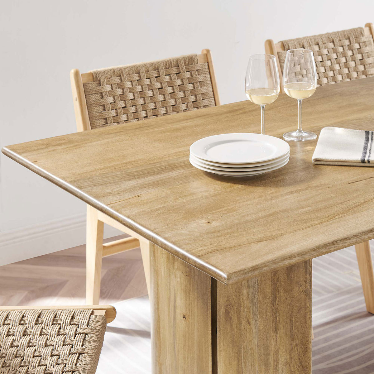 Tabletop styling on the 72 inch oak dining table with dishes, wine glasses, and a striped runner. || EEI-6339-OAK || detail_room