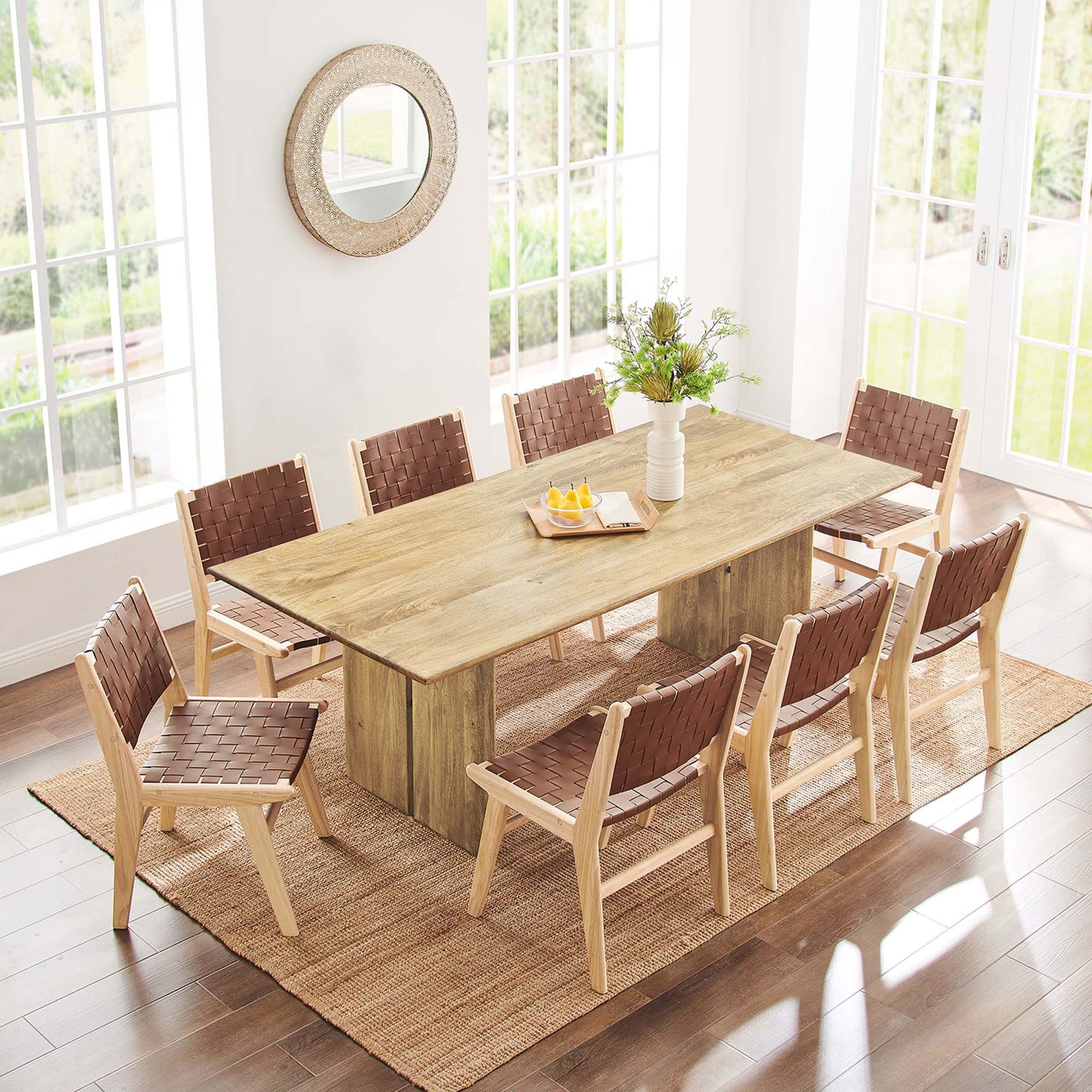 86 inch oak dining table positioned on a natural rug with eight matching chairs. || EEI-6340-OAK || top_angle_room