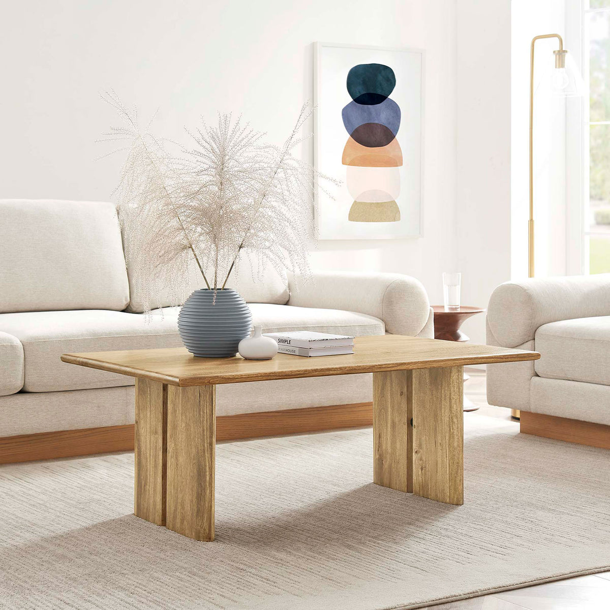 Versatile oak coffee table anchors the room with clean lines and solid mango craftsmanship || EEI-6341-OAK || front_angle_room