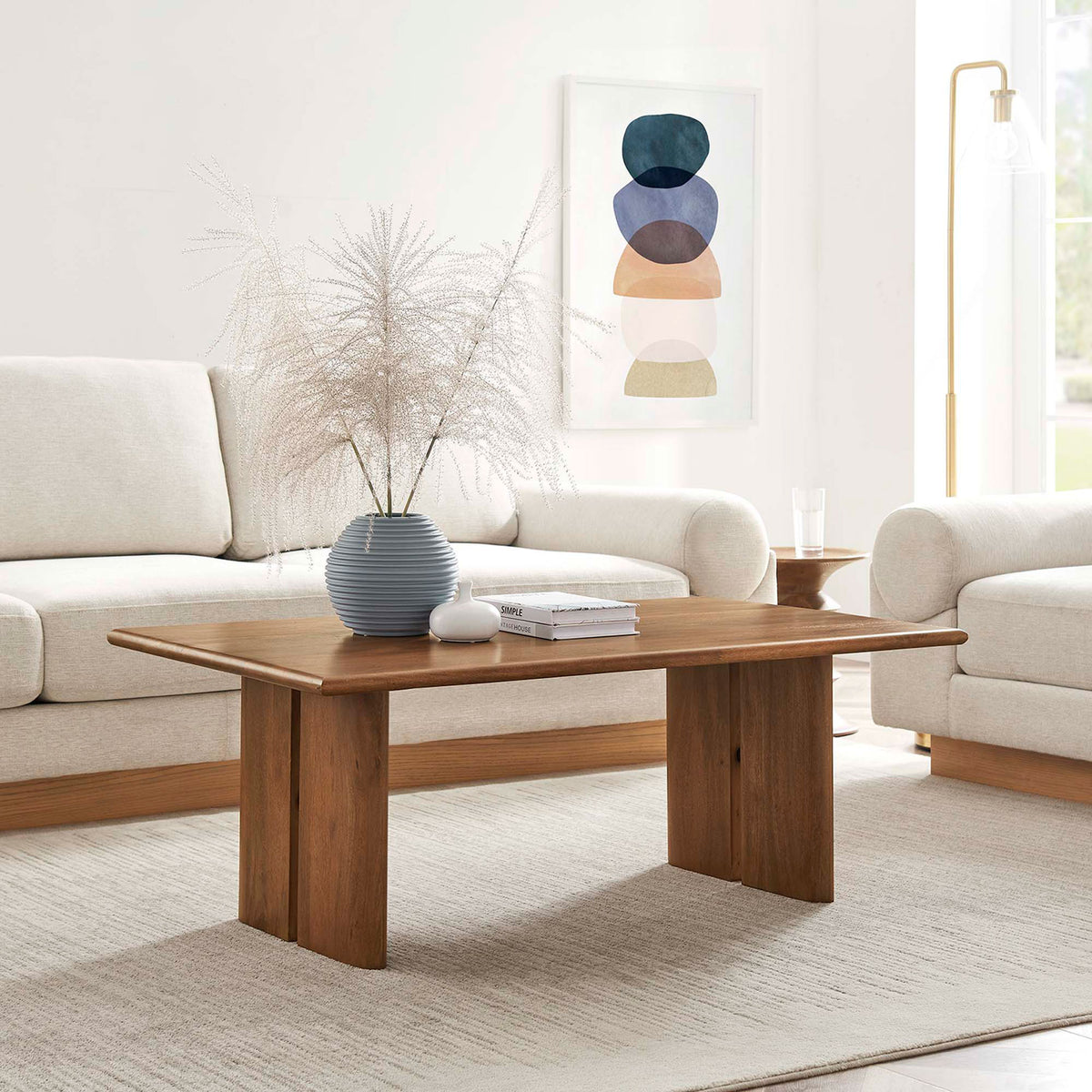 Warm walnut coffee table anchors the living room with clean lines and a spacious surface || EEI-6341-WAL || front_angle_room