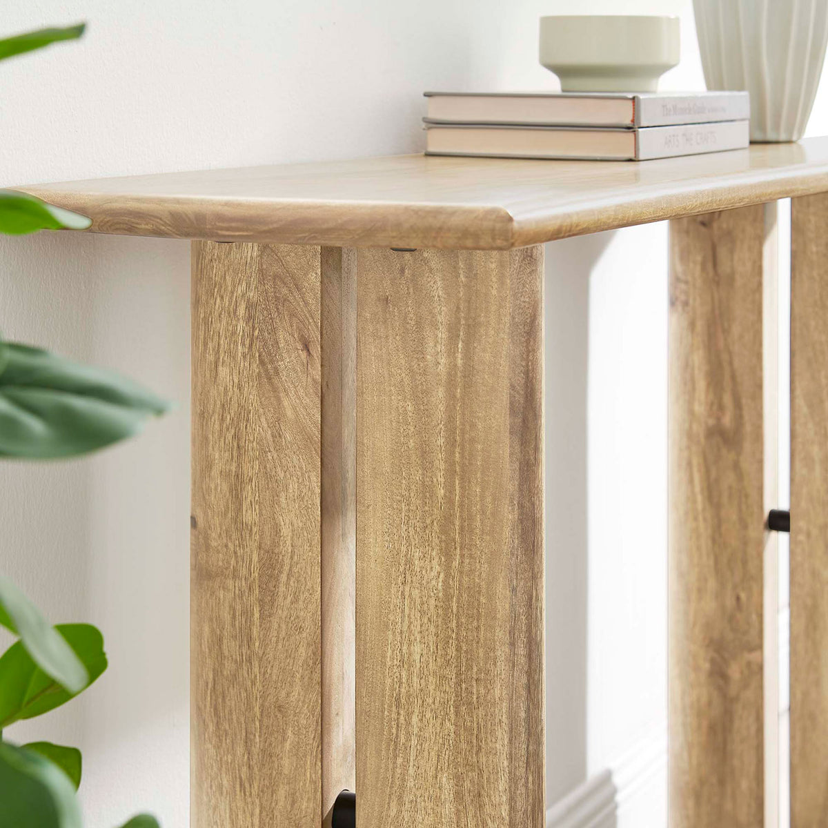 Warm oak console adds natural texture beside greenery and decor || EEI-6342-OAK || detail_room