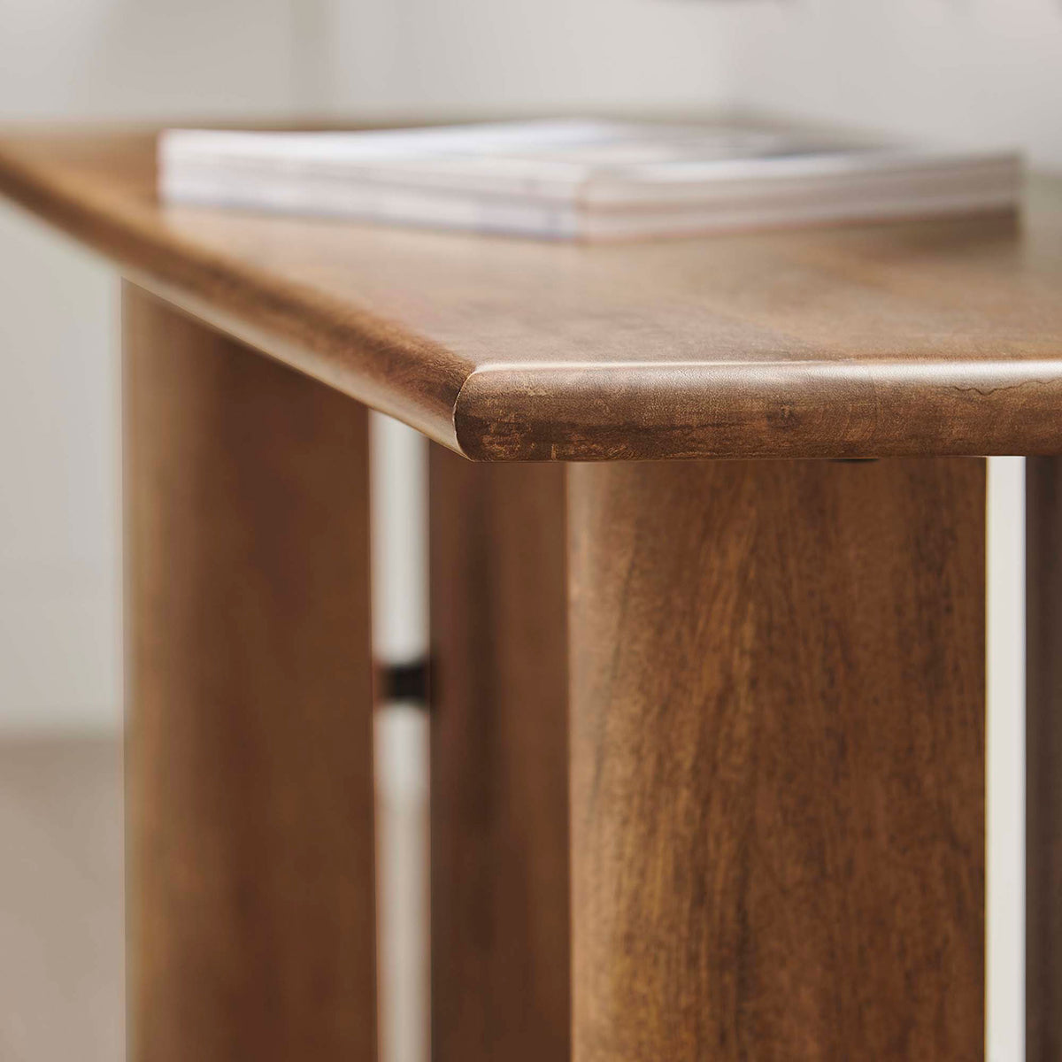 Softly rounded edge and satiny finish highlight the bench's smooth, comfortable surface. || EEI-6343-WAL || detail_room