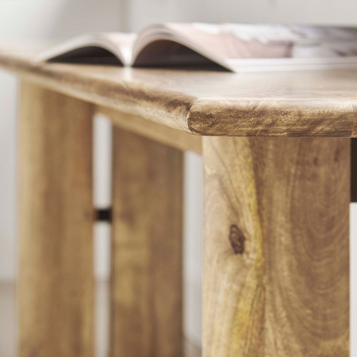 Rounded edge detail adds softness to the elongated silhouette. || EEI-6345-OAK || detail_room