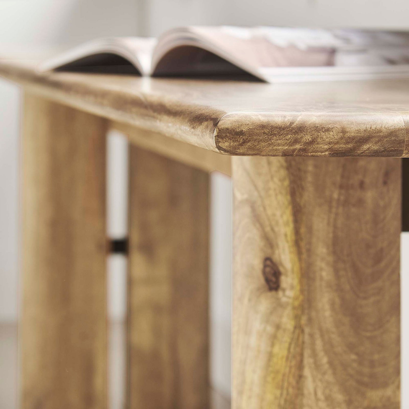 Rounded edge detail adds softness to the elongated silhouette. || EEI-6345-OAK || detail_room