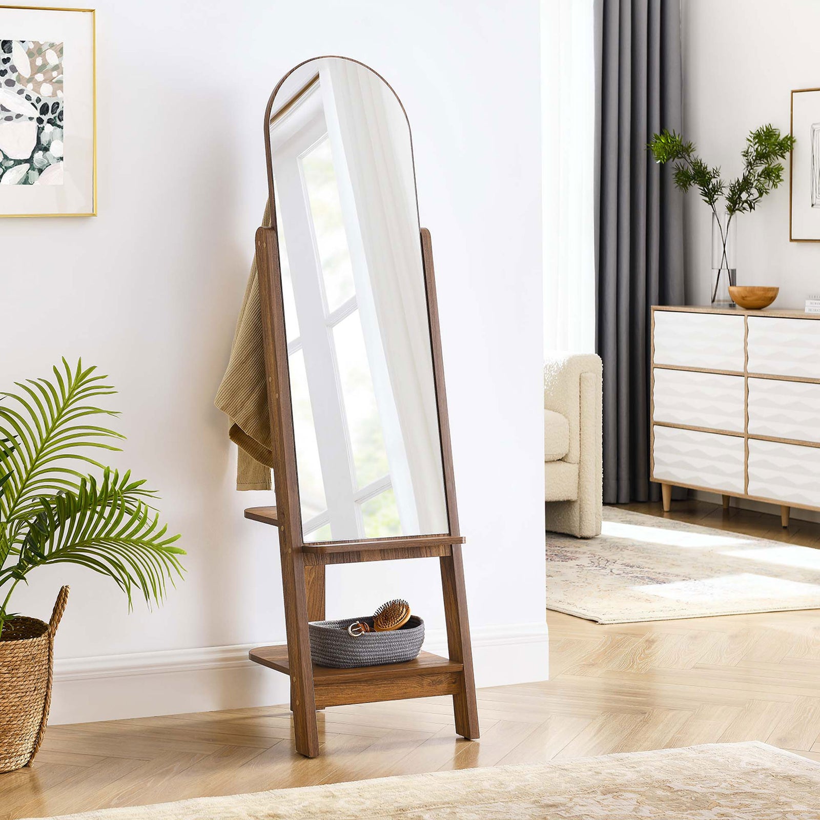 Arched standing mirror styled in a modern living space with towels and decor on the walnut shelves || EEI-6346-WAL || front_angle_room