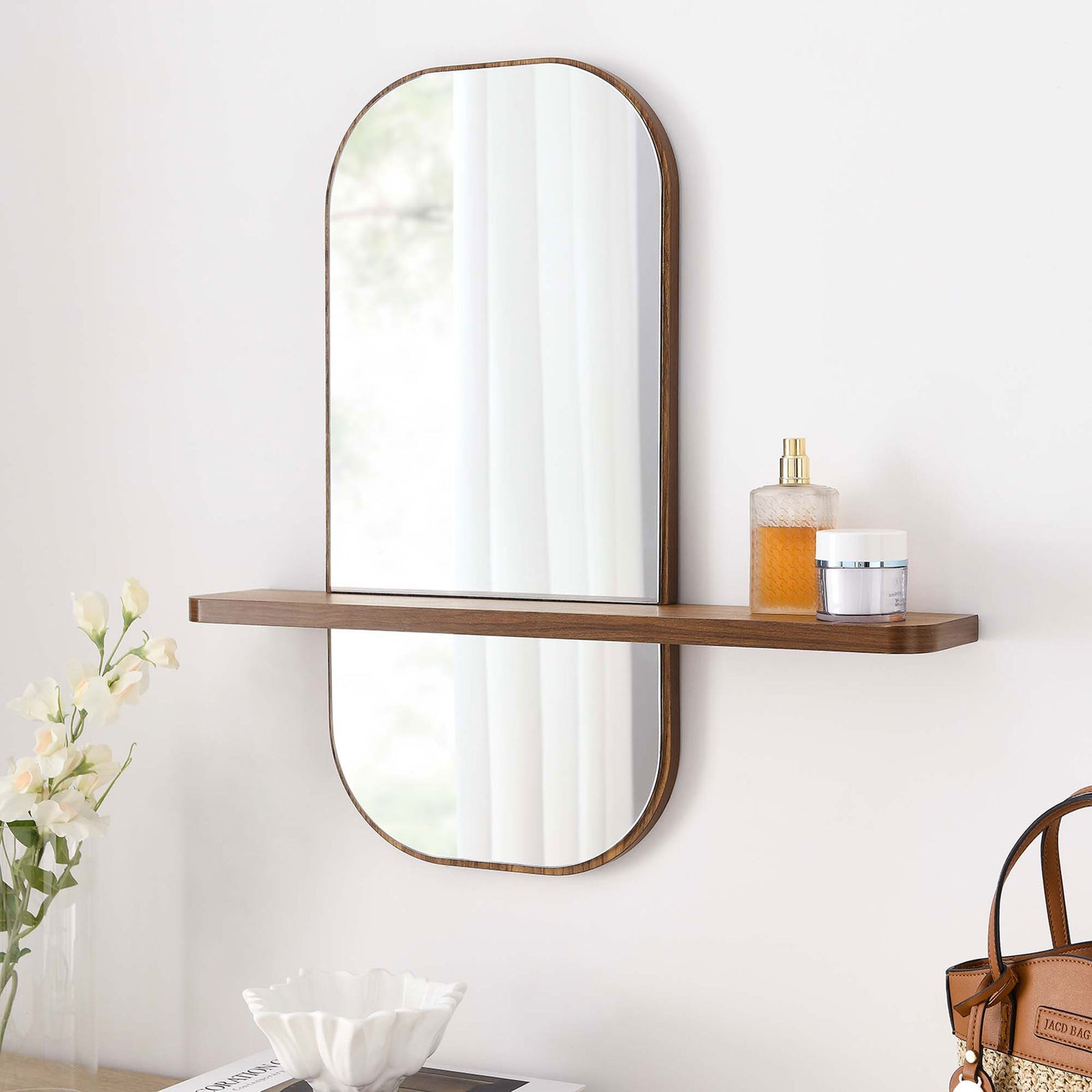 Walnut wall mirror with shelf styled above a tray and handbag for an organized entryway. || EEI-6349-WAL || front_angle_room