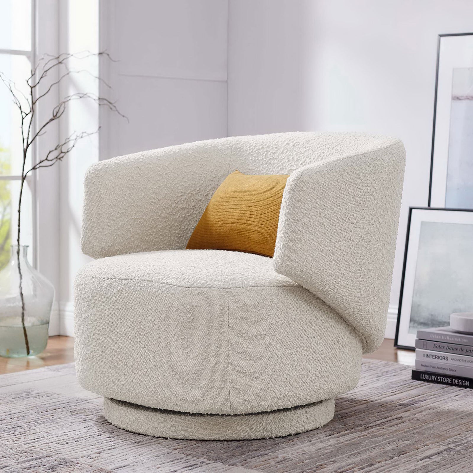 Elevate the living room with an ivory boucle swivel chair, curved for cozy, lounge-worthy comfort. || EEI-6357-IVO || front_angle_room