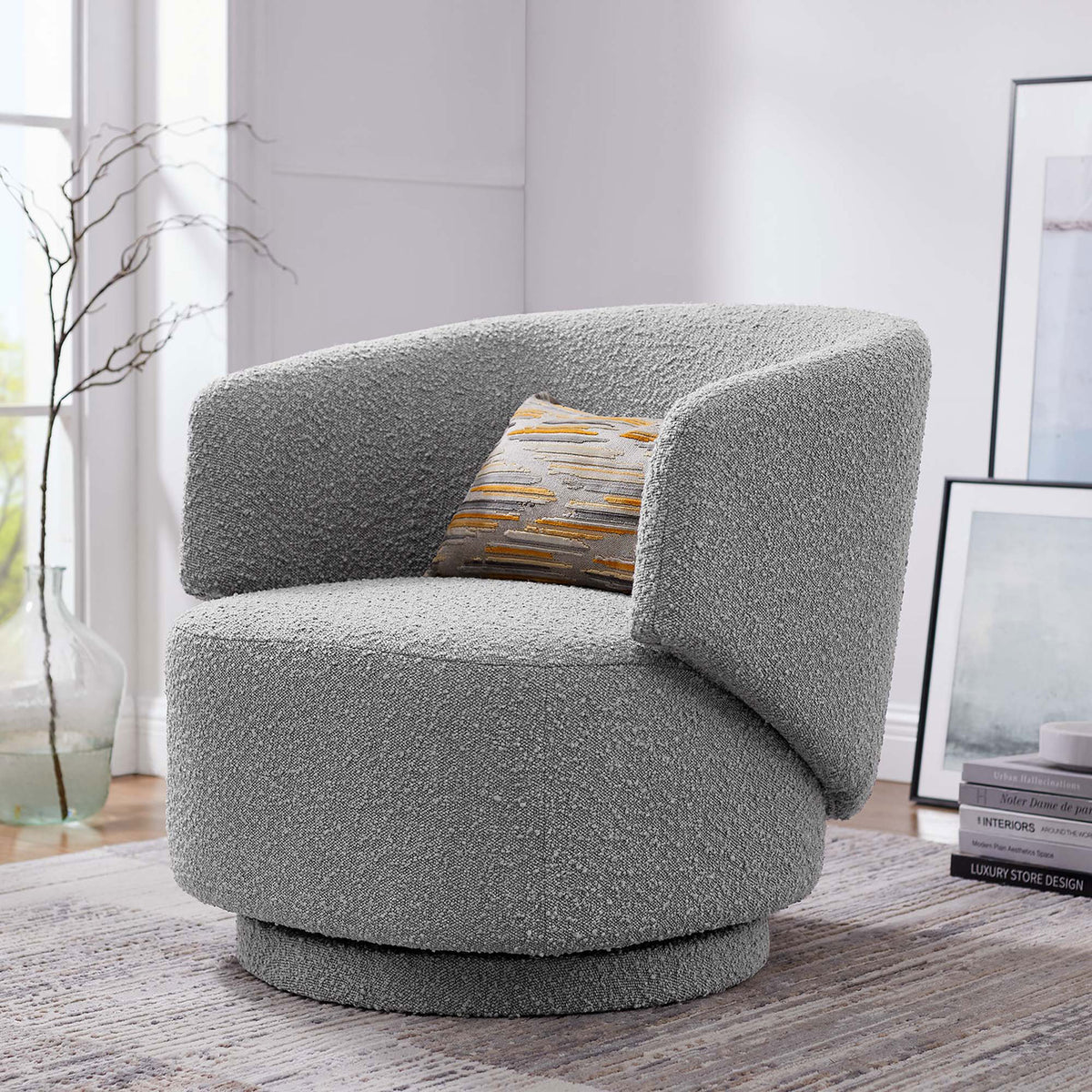 Elevate your lounge with this light gray boucle swivel chair's inviting curves and modern poise || EEI-6357-LGR || front_angle_room