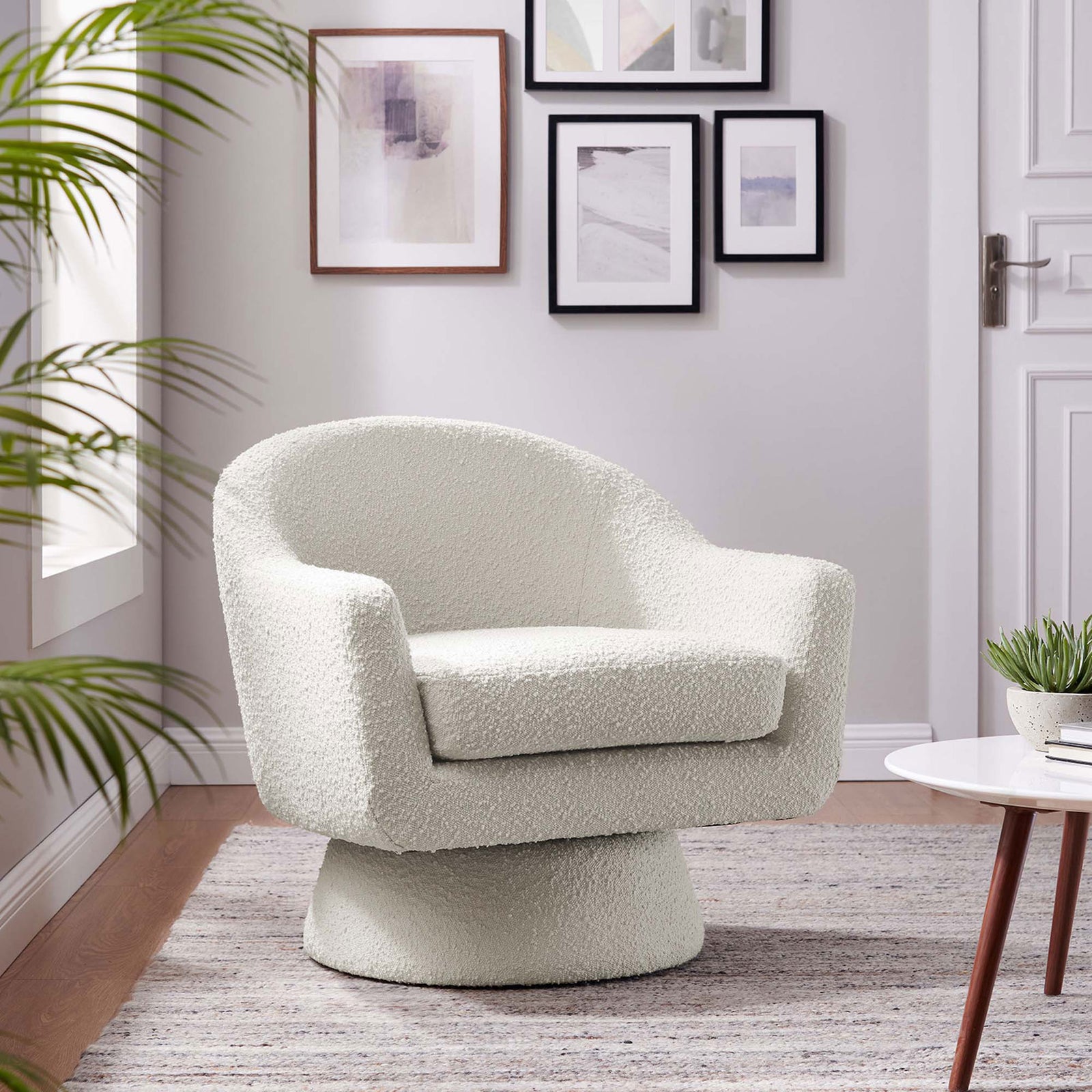 Modern ivory swivel chair adds soft texture and sculptural form to your living room || EEI-6359-IVO || front_angle_room