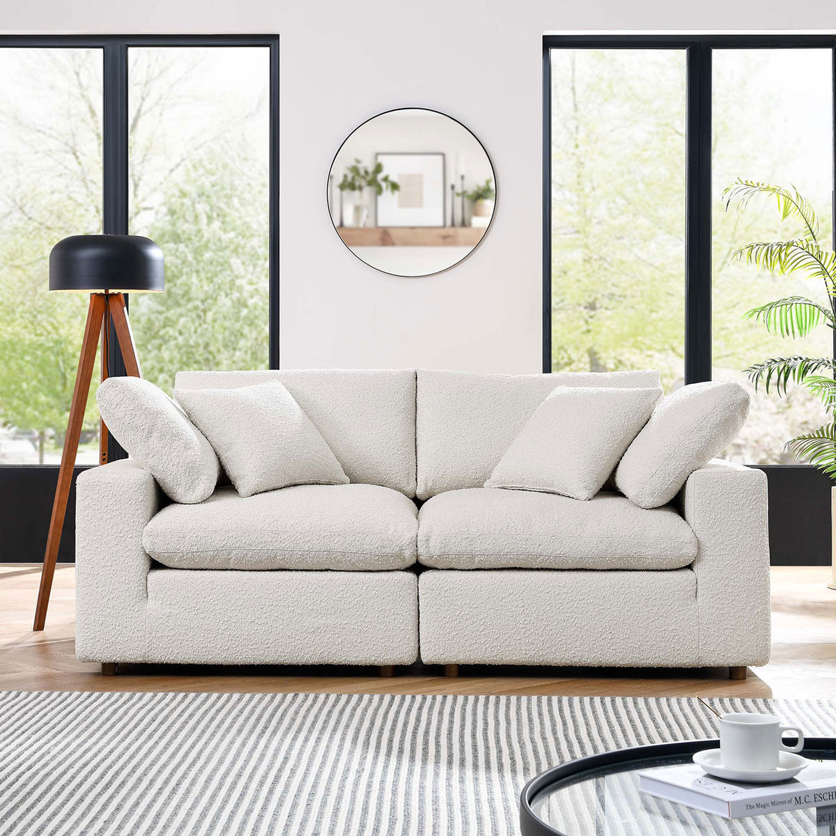 Ivory boucle loveseat showcased in a contemporary living room with large windows and layered cozy textures || EEI-6361-IVO || front_room