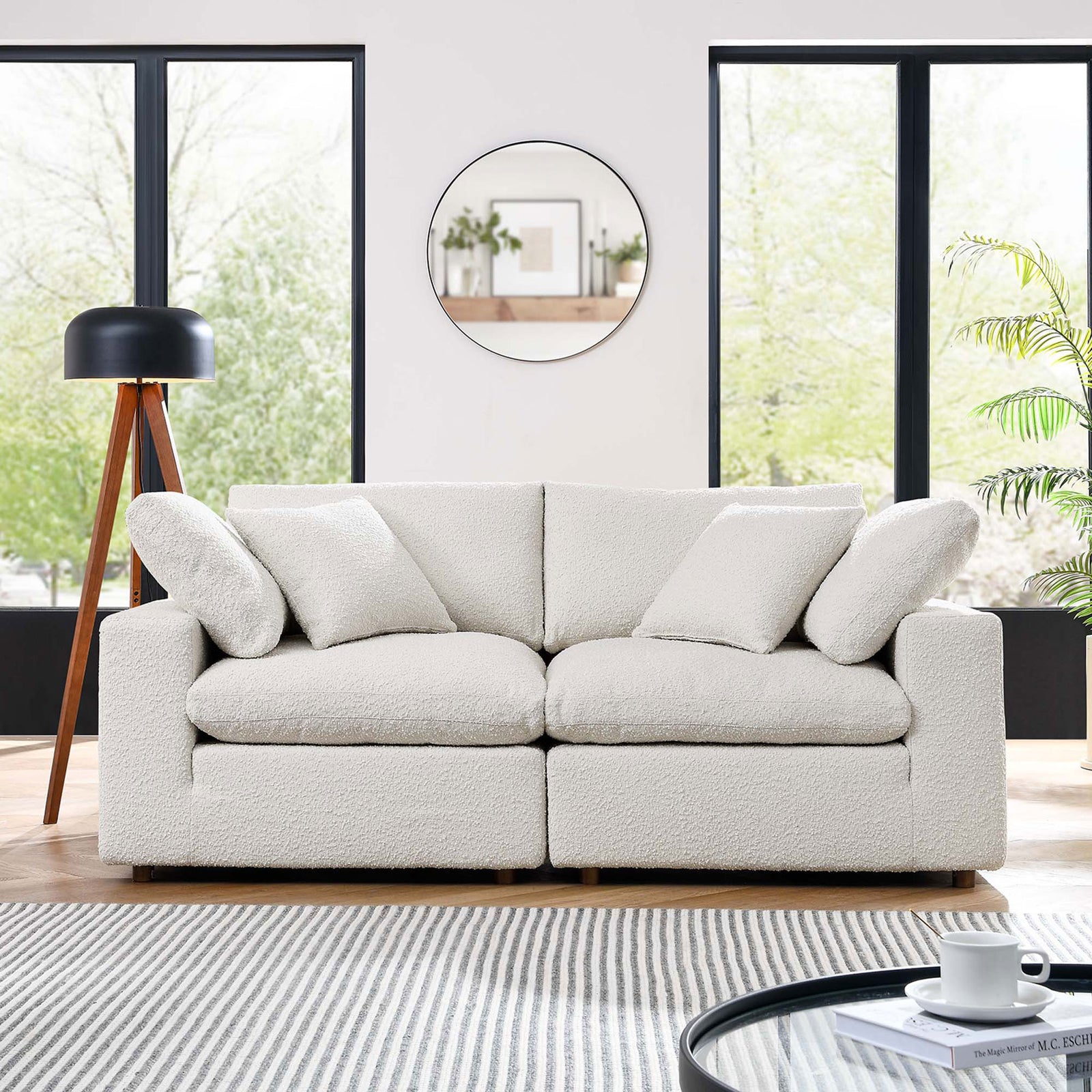 Ivory boucle loveseat showcased in a contemporary living room with large windows and layered cozy textures || EEI-6361-IVO || front_room